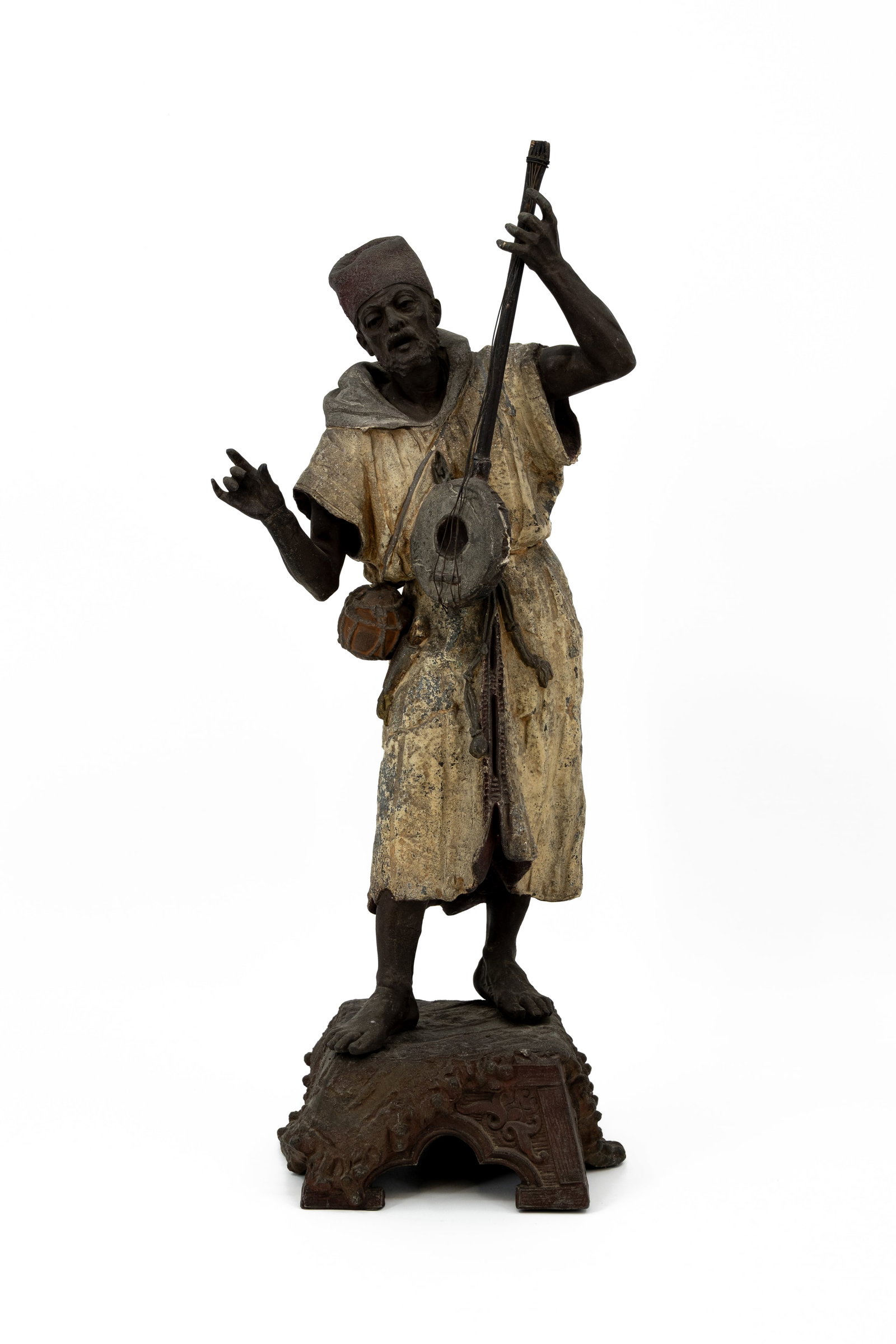 An antique multi-patinated spelter figure representing an Oriental mandolin-playing man (1 of 9)
