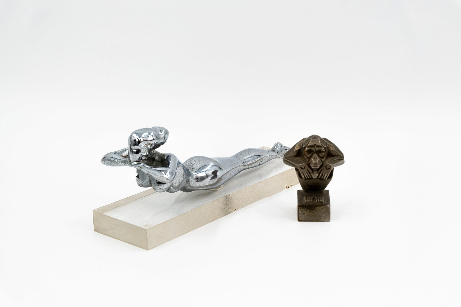 A composed lot of two various car radiator mascots (1 of 13)
