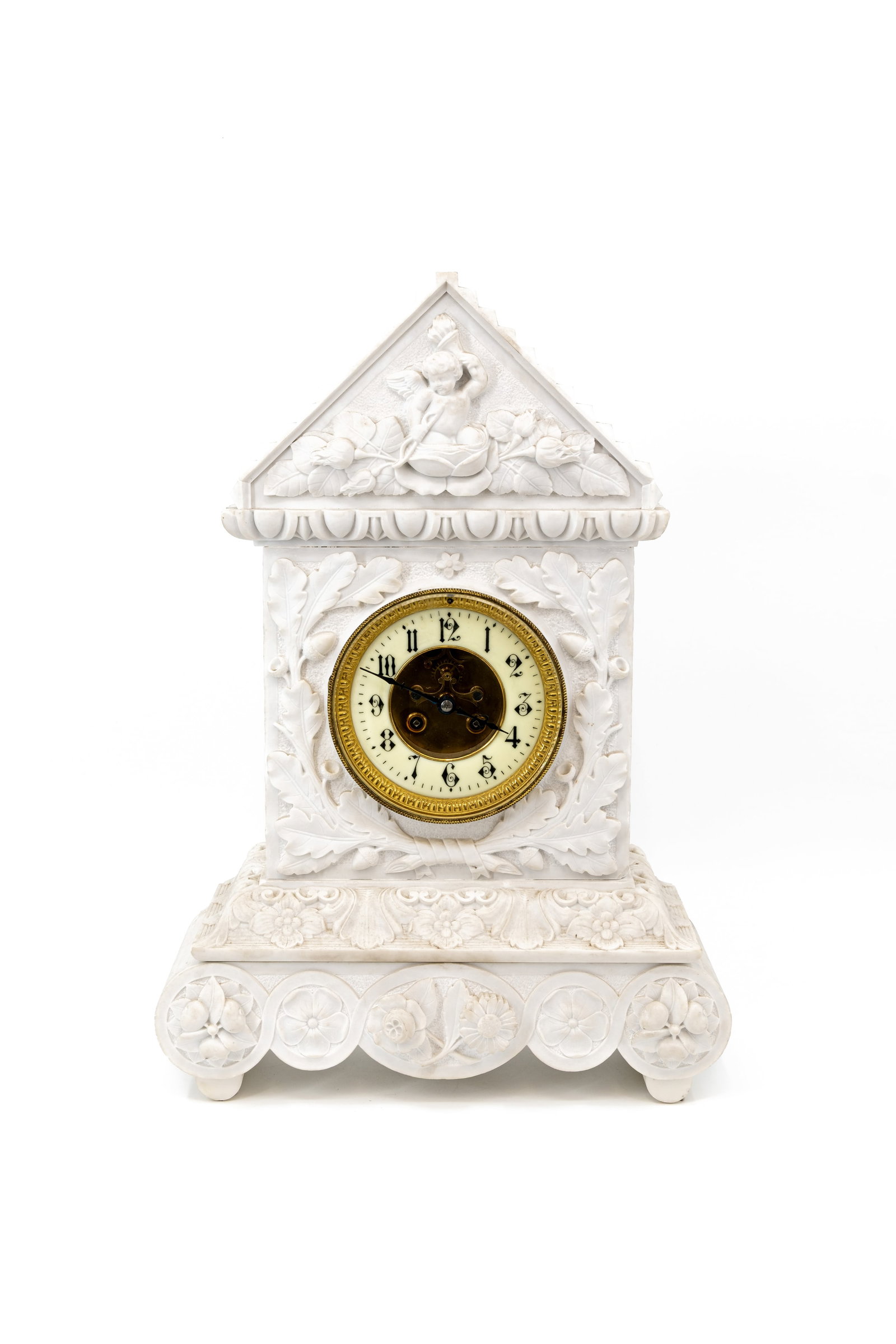 An antique French mantel clock in decorated carved white marble: An antique French mantel clock in decorated carved white marble. Circa 1900-1920s. H: 52 - W: 36 cm
