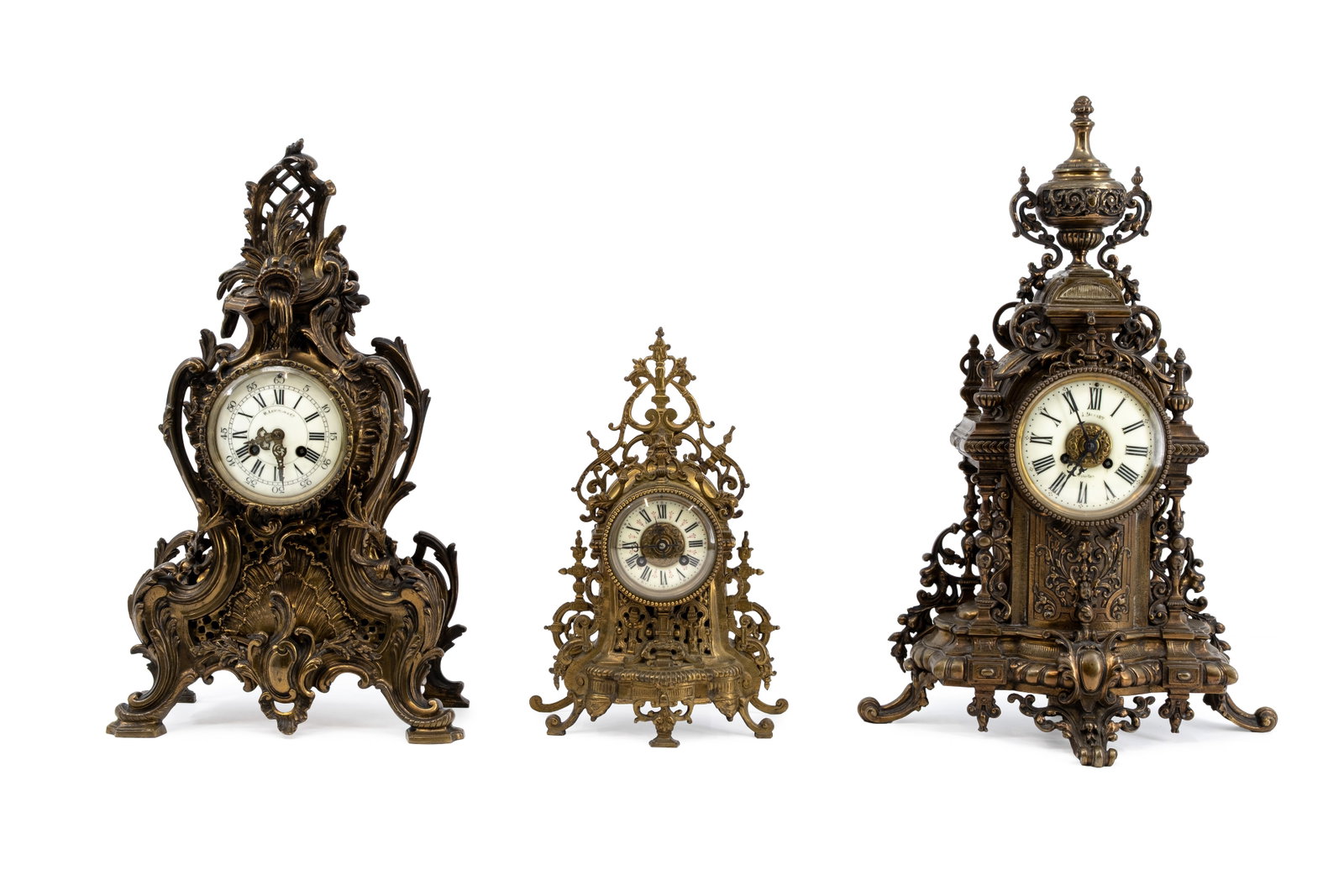 A composed lot of three various antique cathedral shaped mantel clocks (1 of 20)
