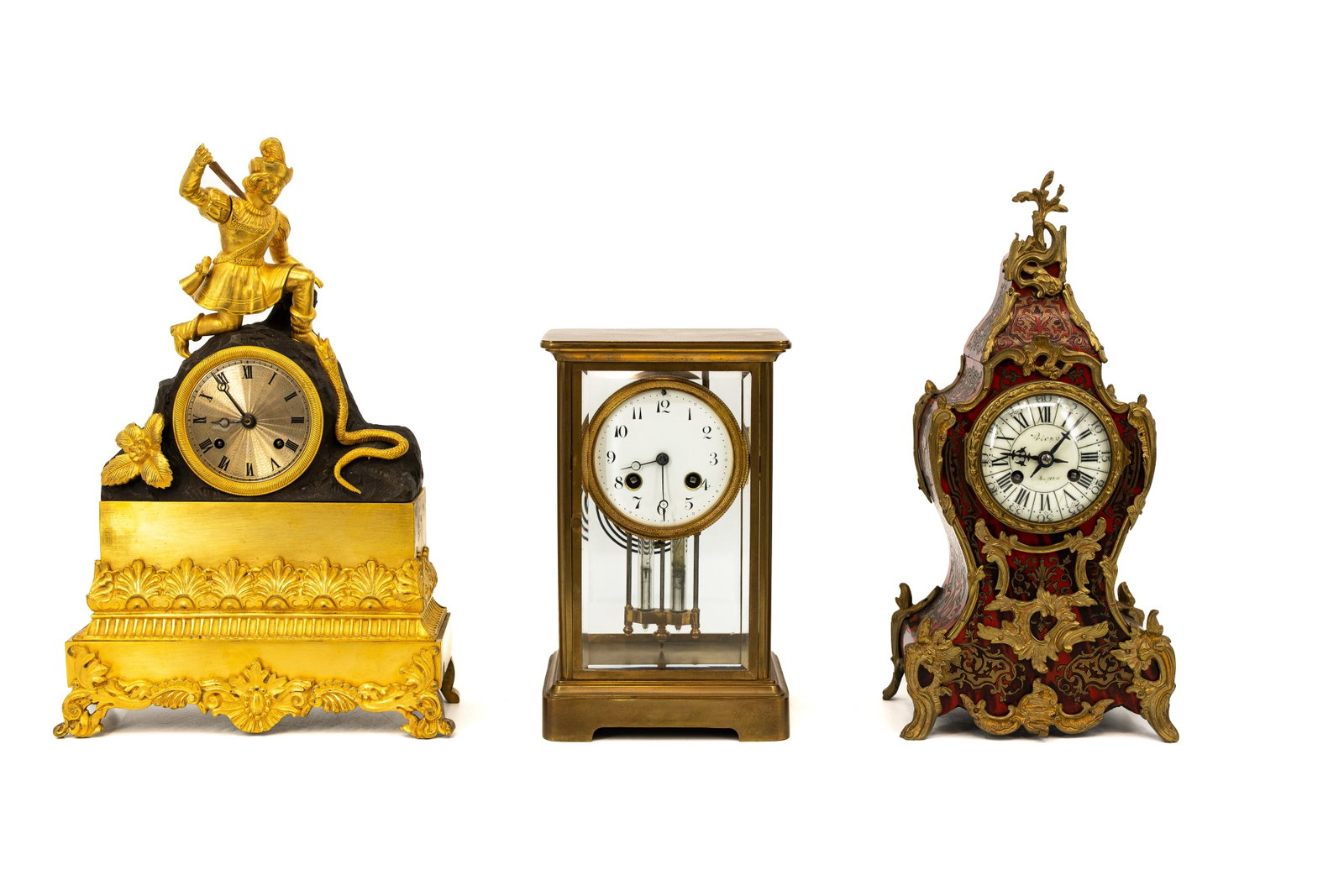 A composed lot of three antique variously shaped desk clocks (1 of 18)