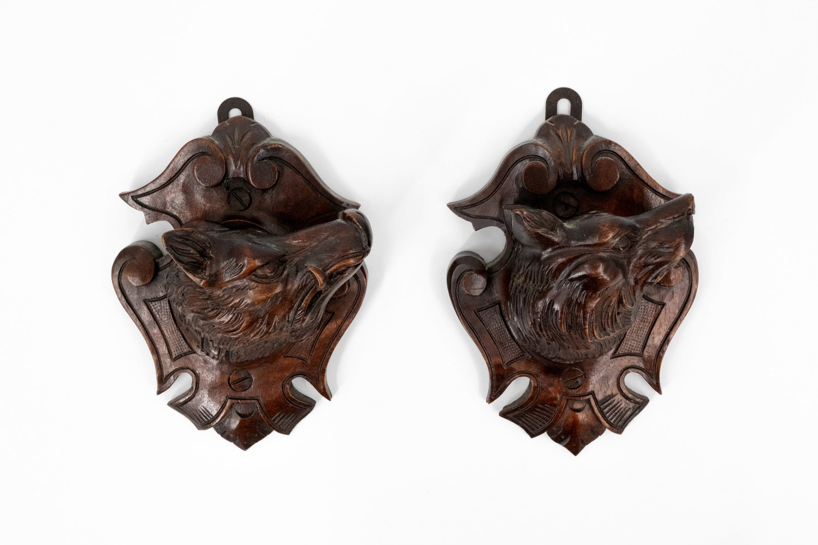A matching pair of small and antique carved wooden Black Forest wall bas-relief sculptures (1 of 4)