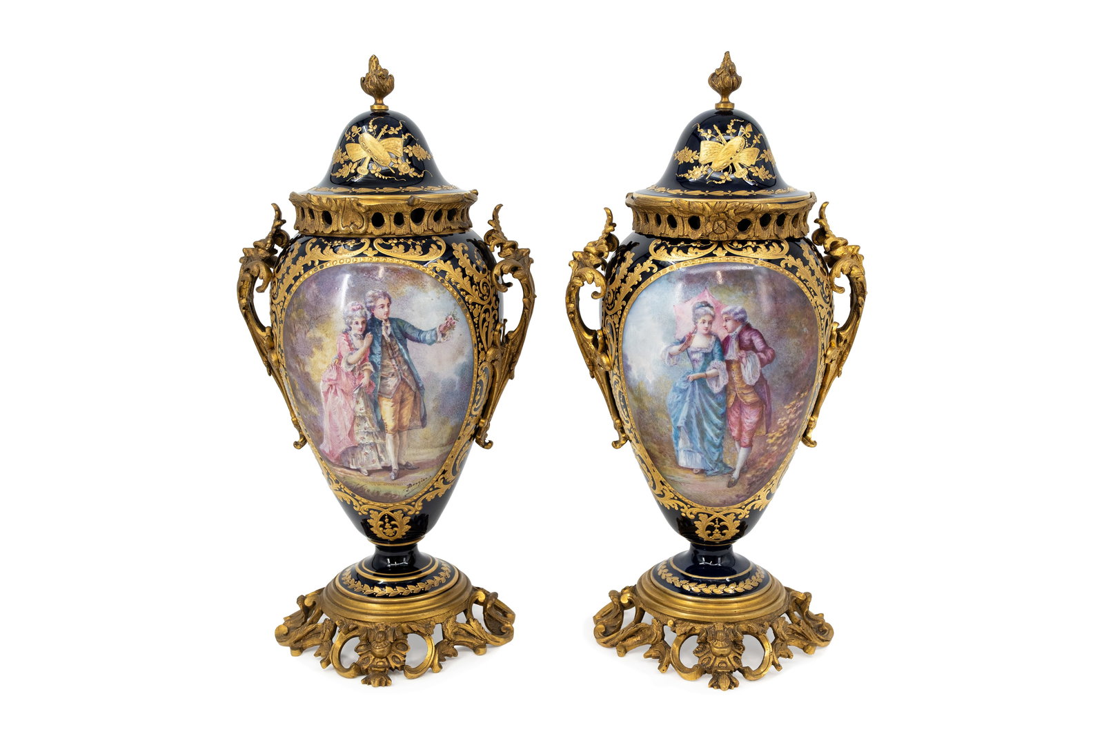 A pair of antique French Sevres style gilt cobalt and decorated porcelain covered vases: A pair of antique French Sevres style gilt cobalt and decorated porcelain covered vases with bronze mounting and figural hand-painted scene. Signed J.Brunier and marked, late 19th century. H: 44 cm