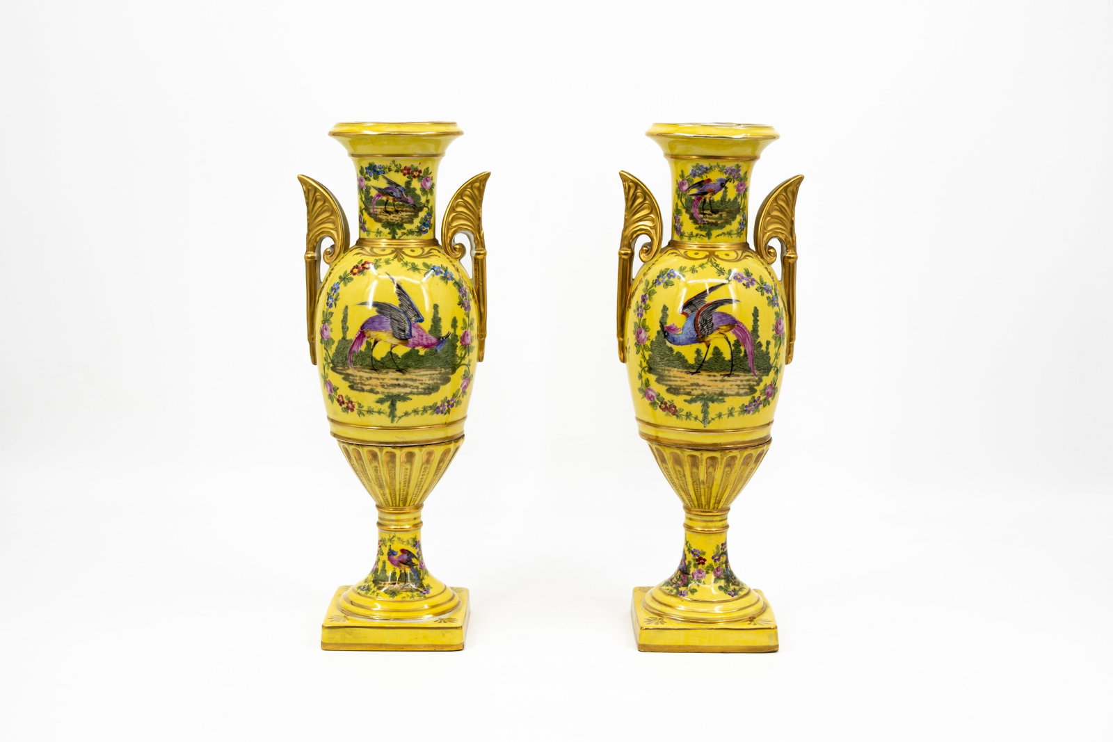 A 20th century pair French Limoges style porcelain vases: A 20th century pair French Limoges style porcelain vases with yellow background and bird scenes. Unmarked, circa 1970s.
