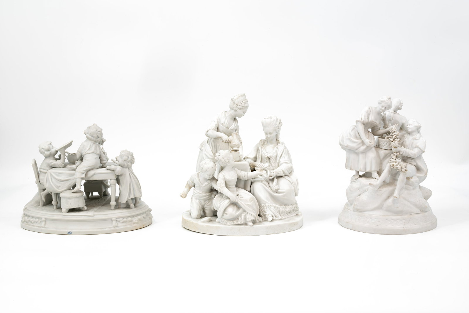 A composed lot of three various antique figural biscuit groups (1 of 12)