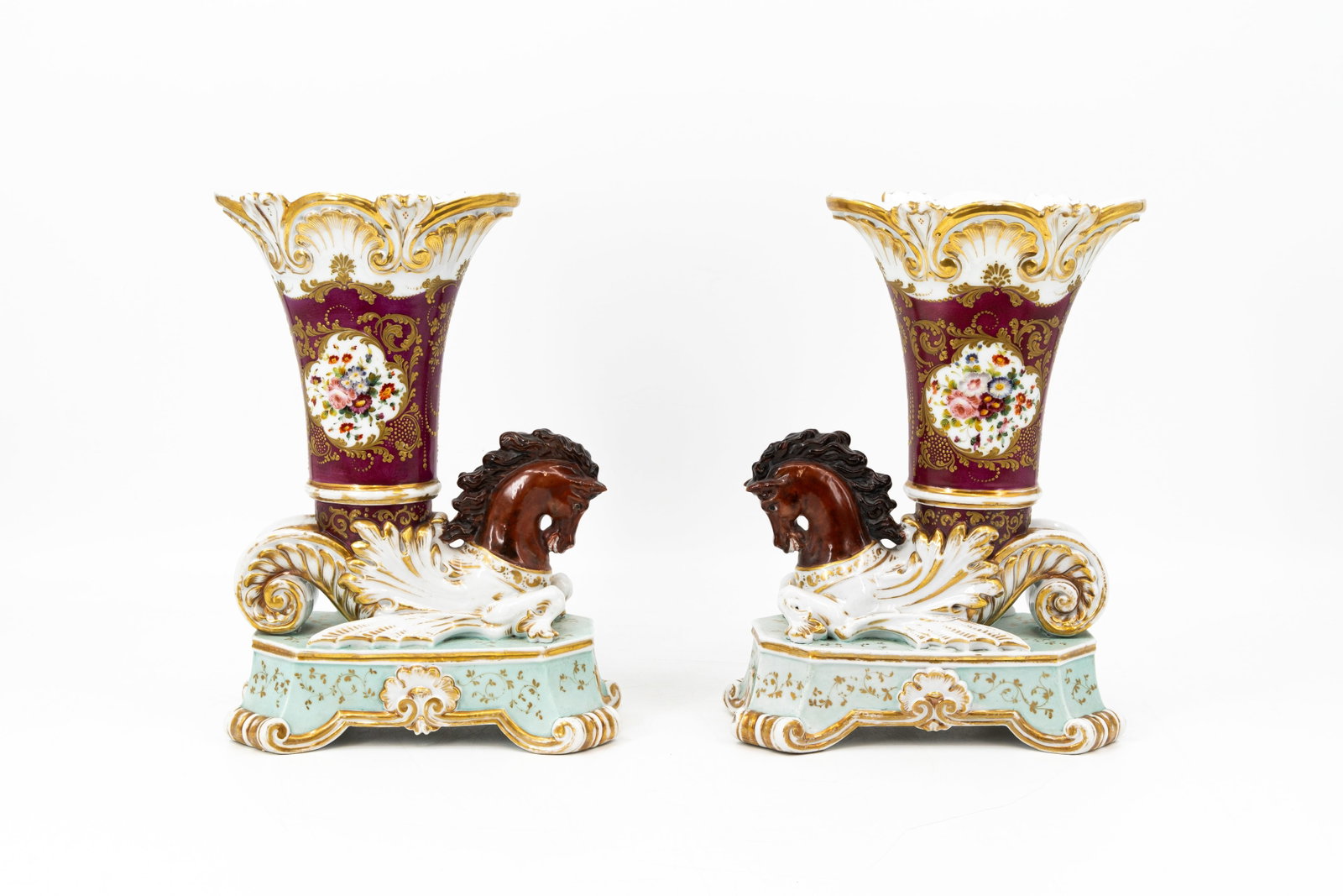 Jacob PETIT (1796-1868) In the manner of. A pair of antique French Paris porcelain vases: Jacob PETIT (1796-1868) In the manner of. A pair of antique French Paris gilt decorated porcelain horse shaped vases. 19th century. H: 30 - W: 23 cm