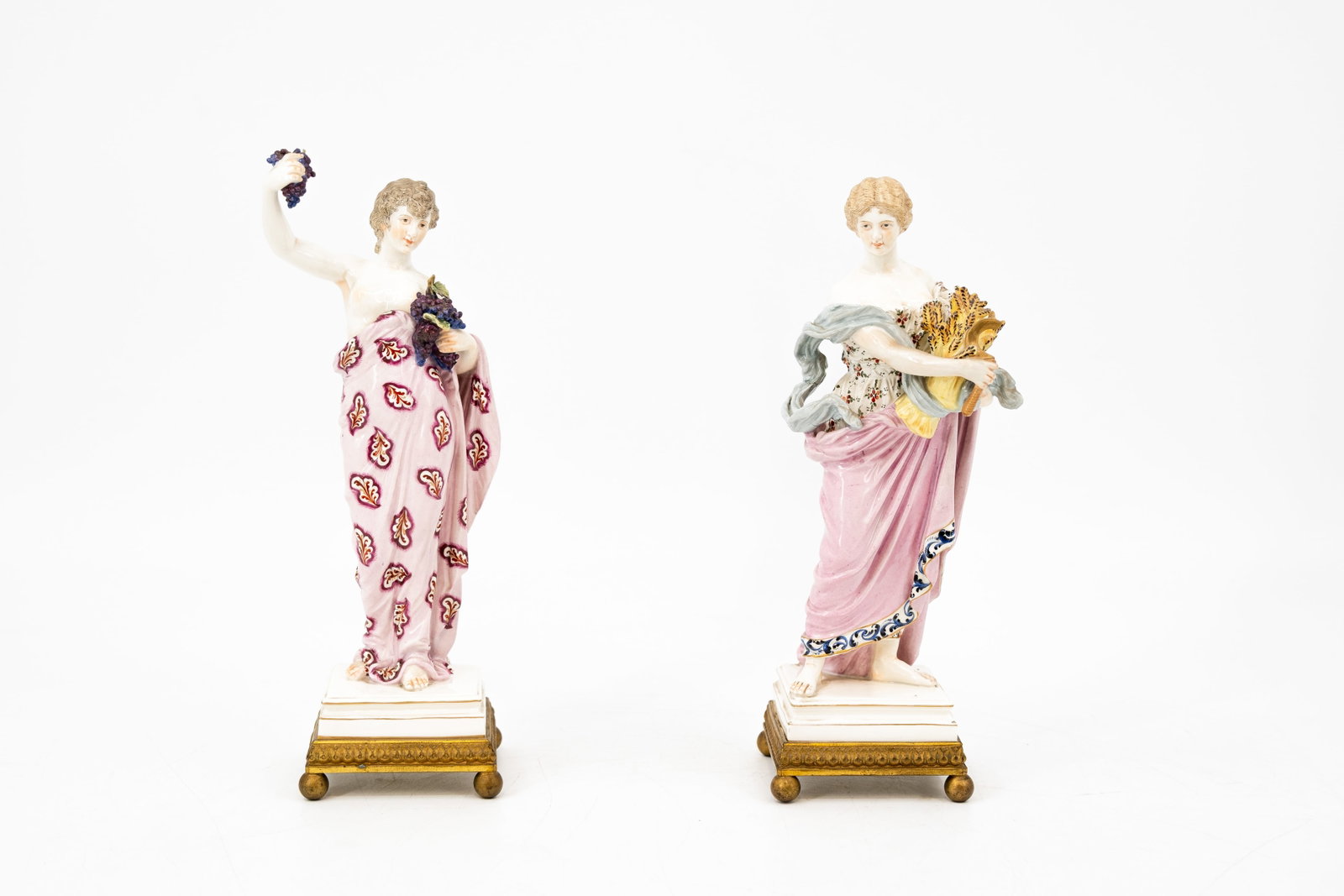 A lot of two matching German Frankenthal-style finely decorated porcelain figures: A lot of two matching German Frankenthal-style finely decorated porcelain figures of two standing ladies. Mounted on a brass base. Marked, first half 20th century. H: 24,5 - 25 cm
