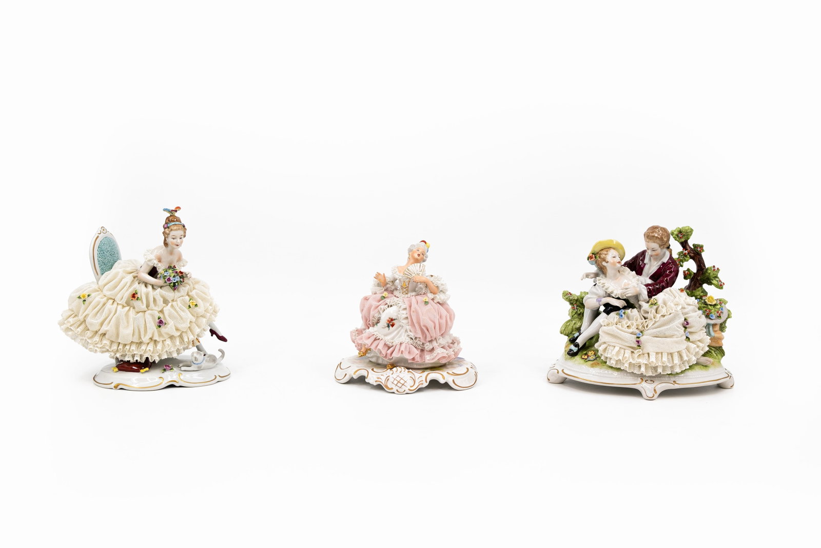 A composed lot of three Saxon-style finely decorated porcelain figural groups (1 of 10)