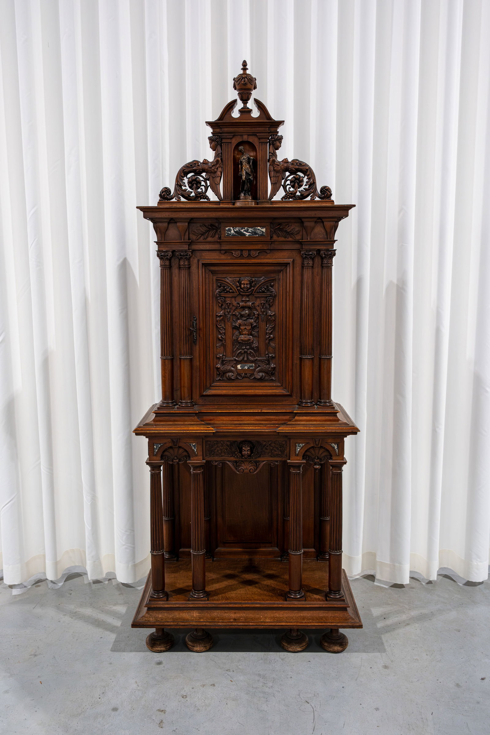 An antique Renaissance-style decorated carved wood cabinet with columns (1 of 11)