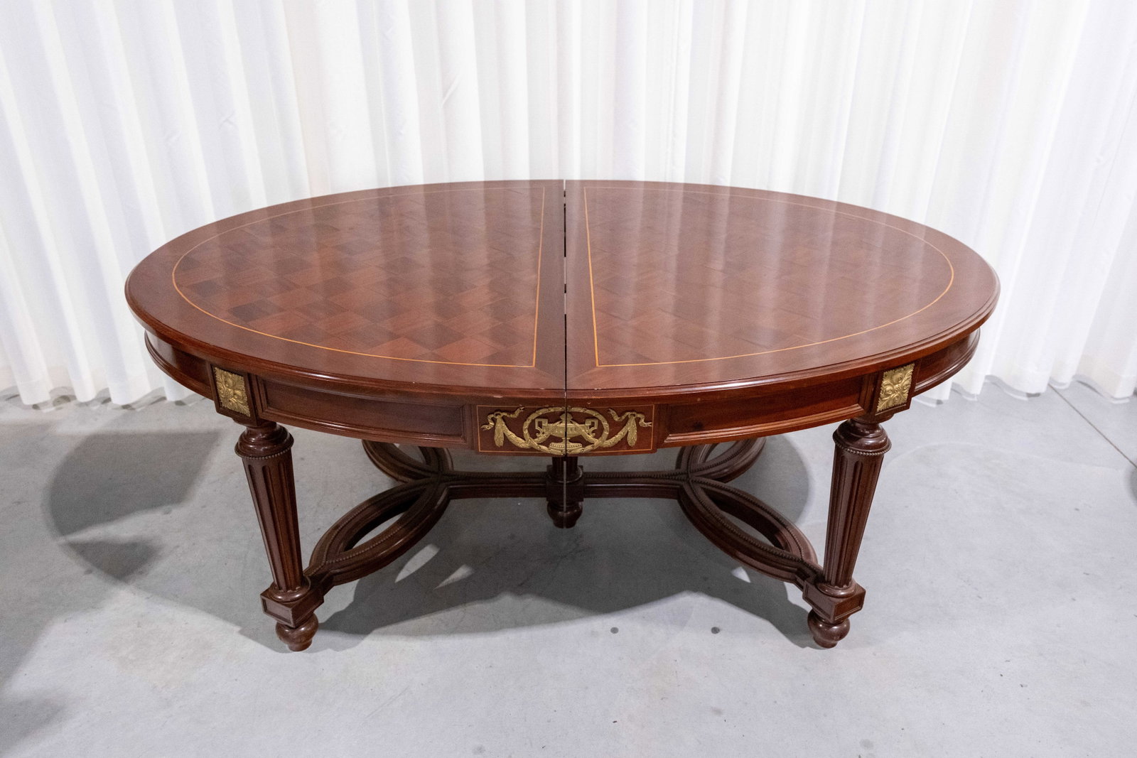 An antique French mahogany dining table with geometric marquetry inlay (1 of 5)