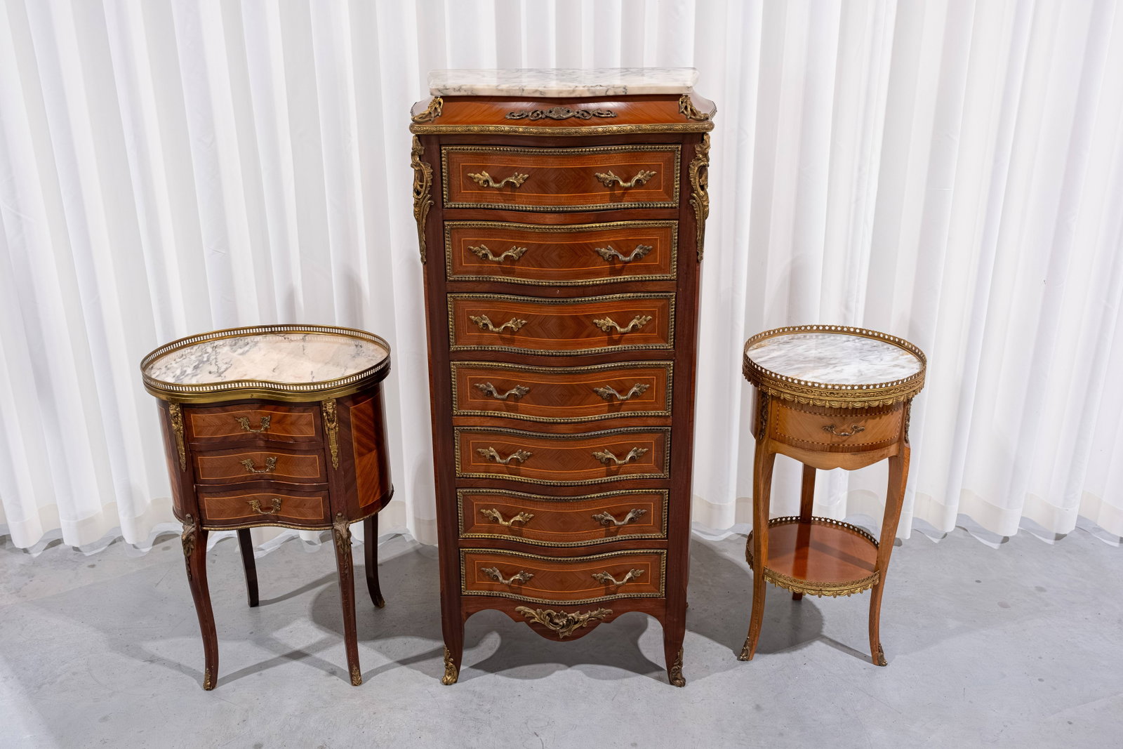A composed lot of two 20th century Louis XV-style brass-mounted side tables and a high commode (1 of 13)