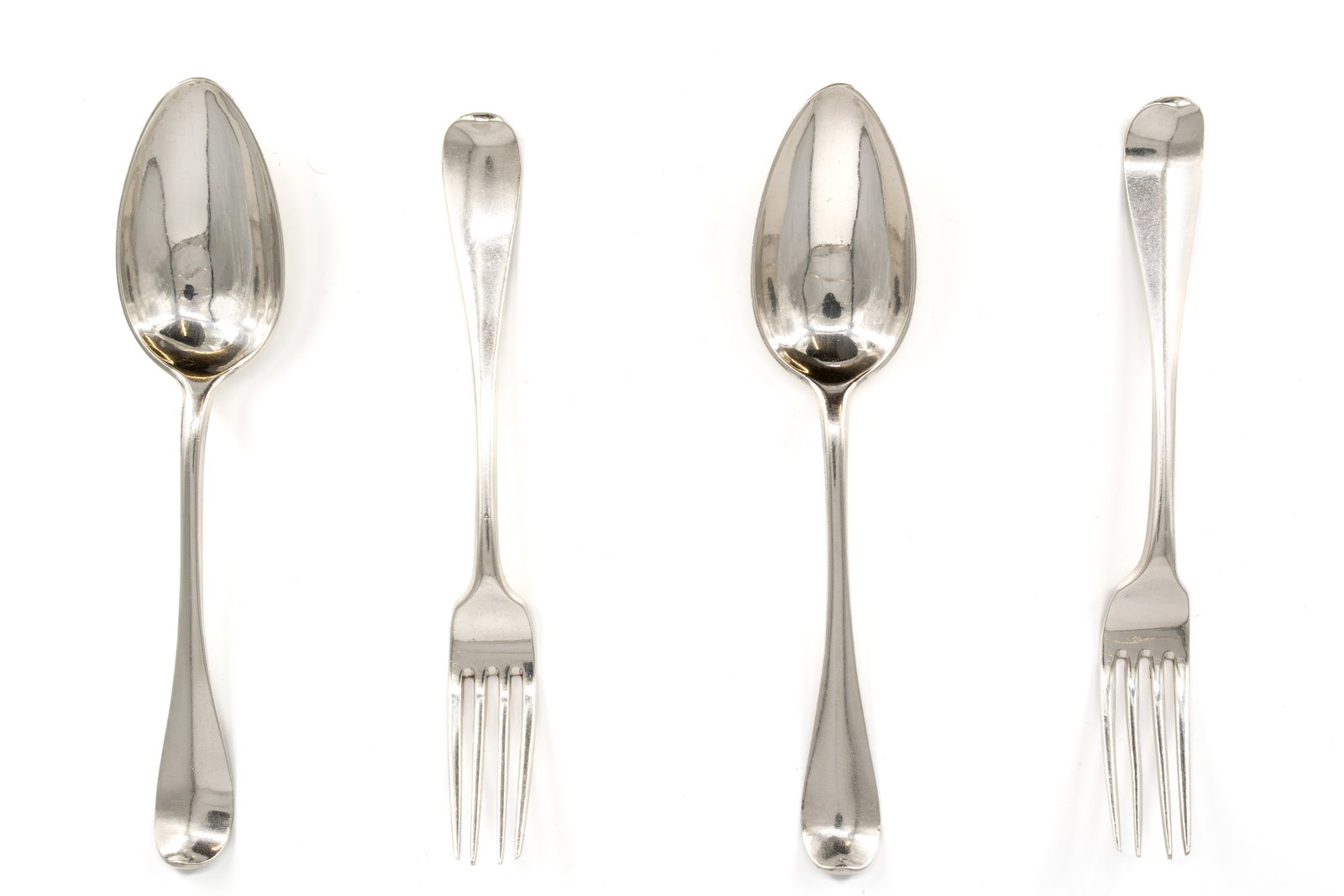 A set of four matching Dutch Rotterdam antique silver forks and spoons: A set of four matching Dutch Rotterdam antique silver forks and spoons. 18th/19th century.