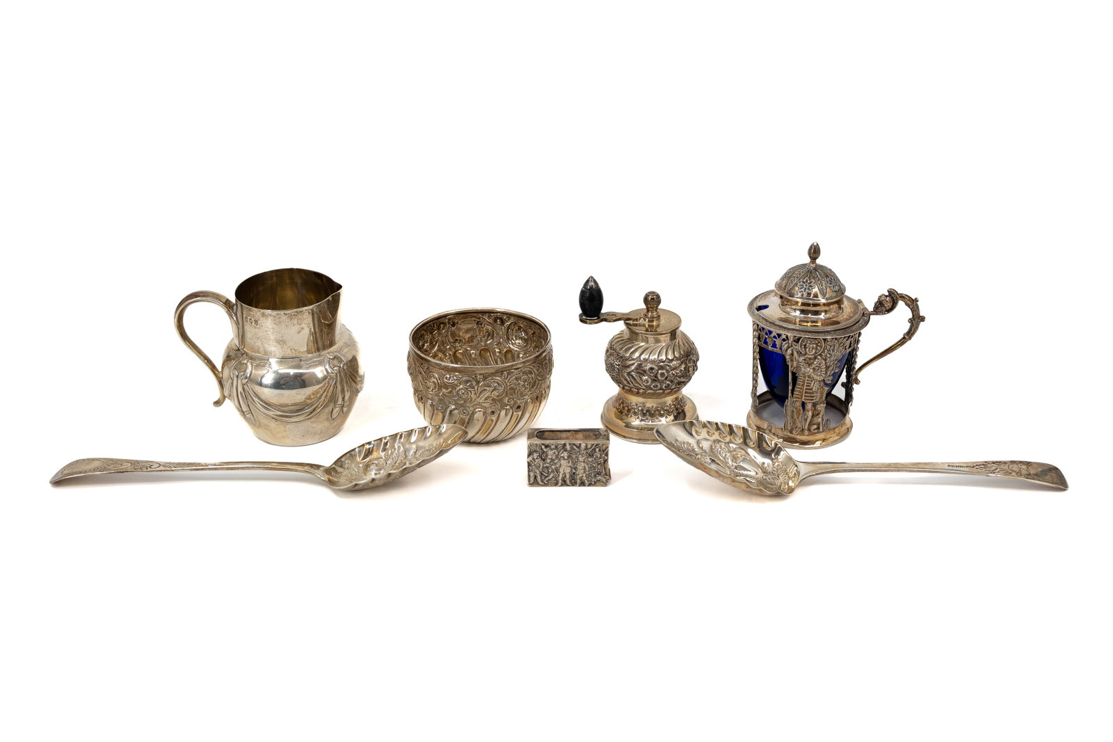 A composed lot of seven antique variously shaped and decorated silver objects (1 of 20)