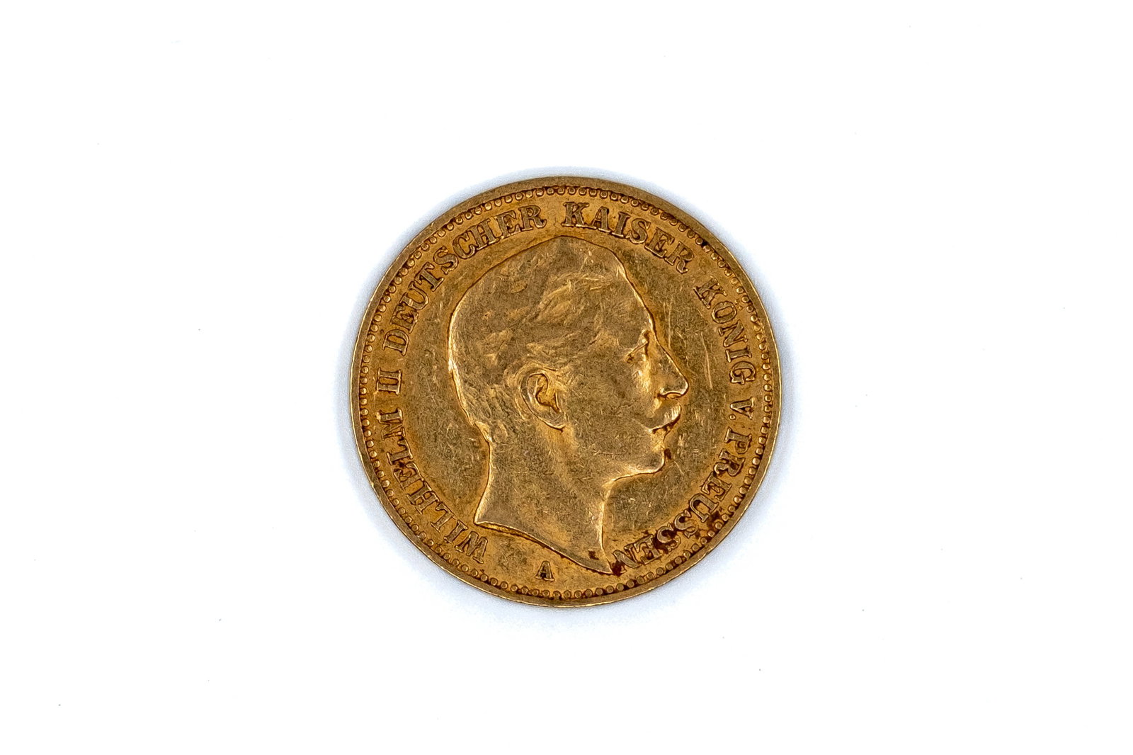 A German gold 20 Mark coin of Wilhelm II, dated 1894: A German gold 20 Mark coin of Wilhelm II, dated 1894. With bare head of Wilhelm II on the obverse, and imperial eagle with crowned shield on the reverse. Weight: 8g