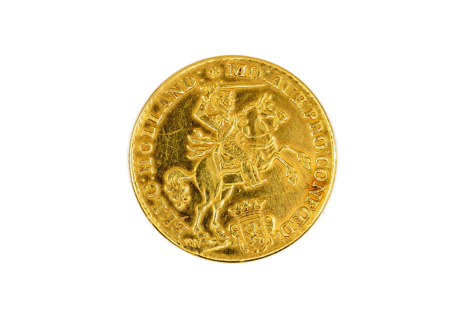 A Dutch gold 14 gulden coin of Holland, dated 1750: A Dutch gold 14 gulden coin of Holland, dated 1750. With armoured rider on horseback above crowned provincial arms, the reverse with crowned lion shield and value 14 G. Weight: 9,7g