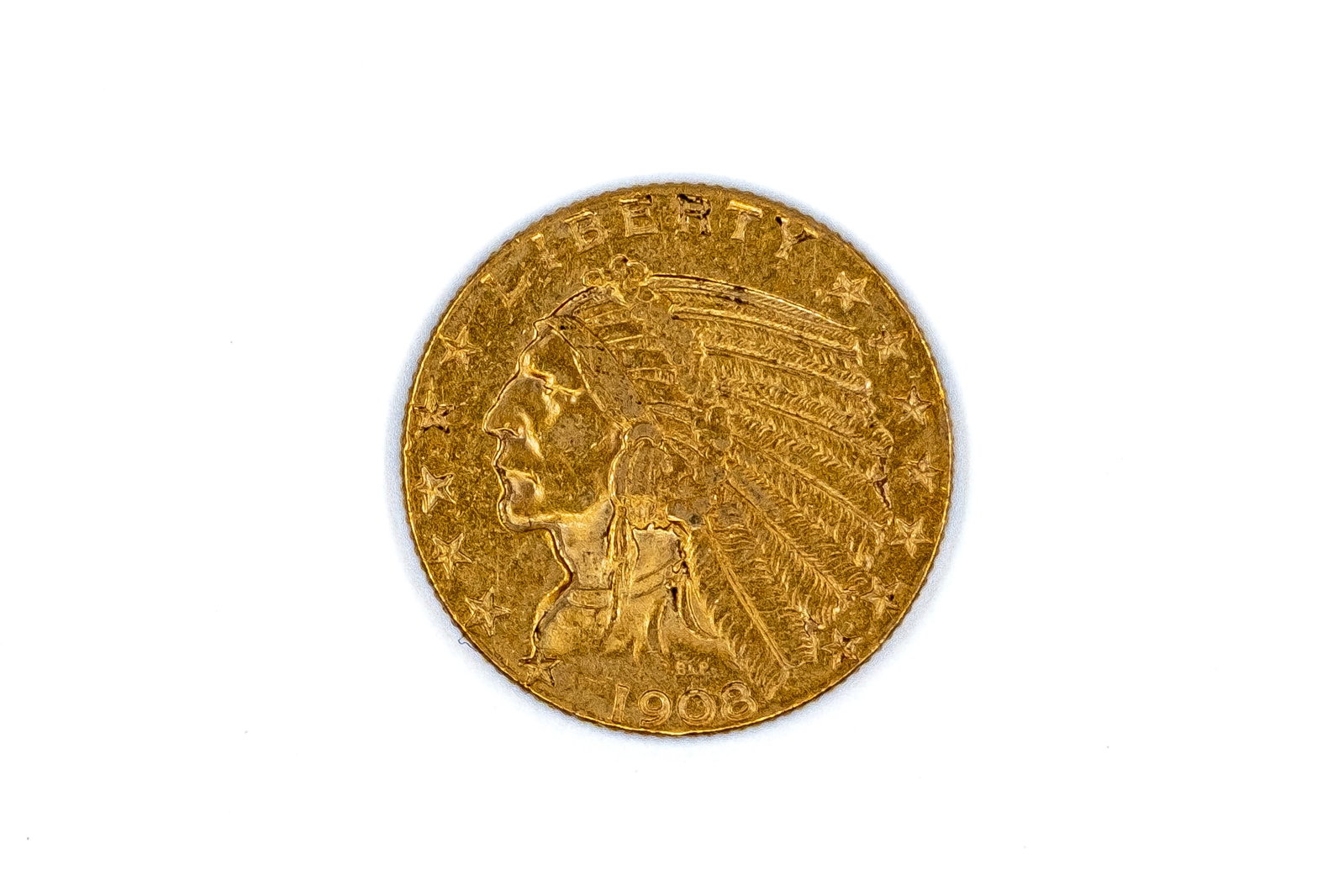 A United States gold 5 Dollars coin, Indian Head type, dated 1908: A United States gold 5 Dollars coin, Indian Head type, dated 1908. With Native American head in feathered headdress on the obverse, and standing eagle on the reverse. Weight: 8,3g