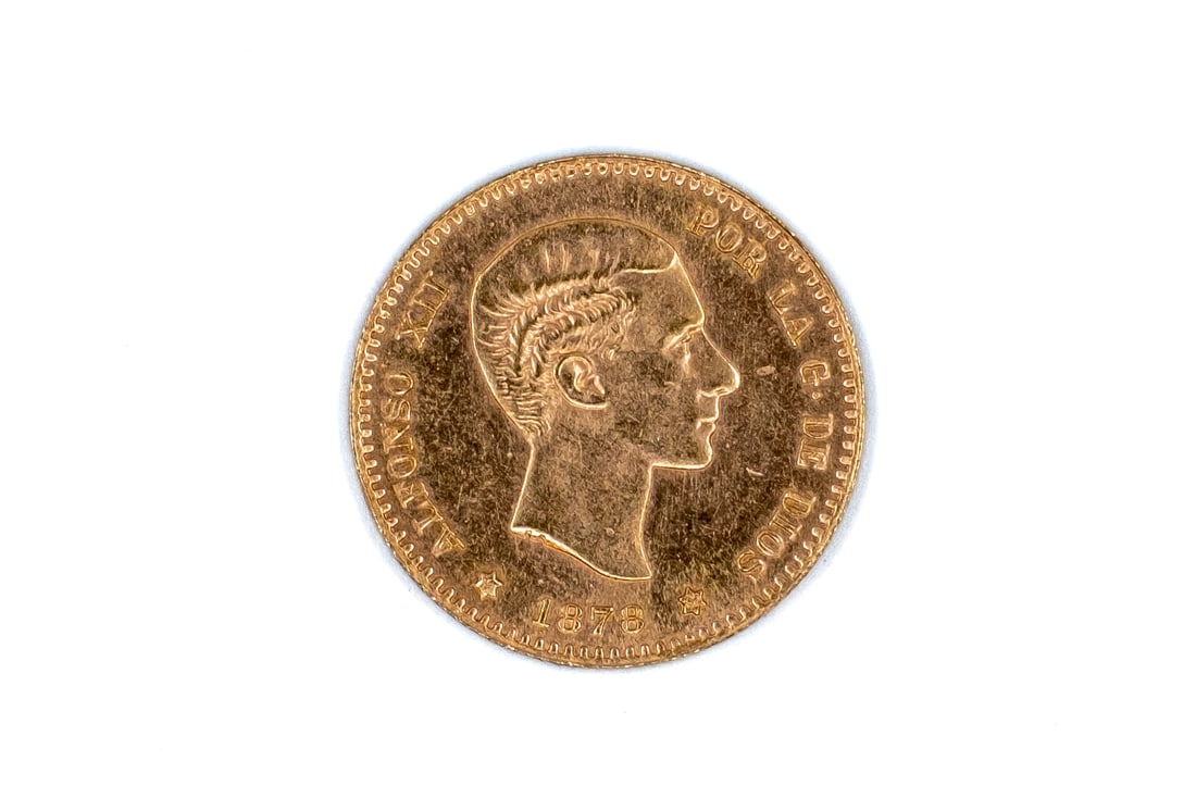 A Spanish gold 10 Pesetas coin of Alfonso XII, dated 1878: A Spanish gold 10 Pesetas coin of Alfonso XII, dated 1878. With bare head of Alfonso XII on the obverse, and crowned arms of Spain on the reverse. Weight: 3,2g