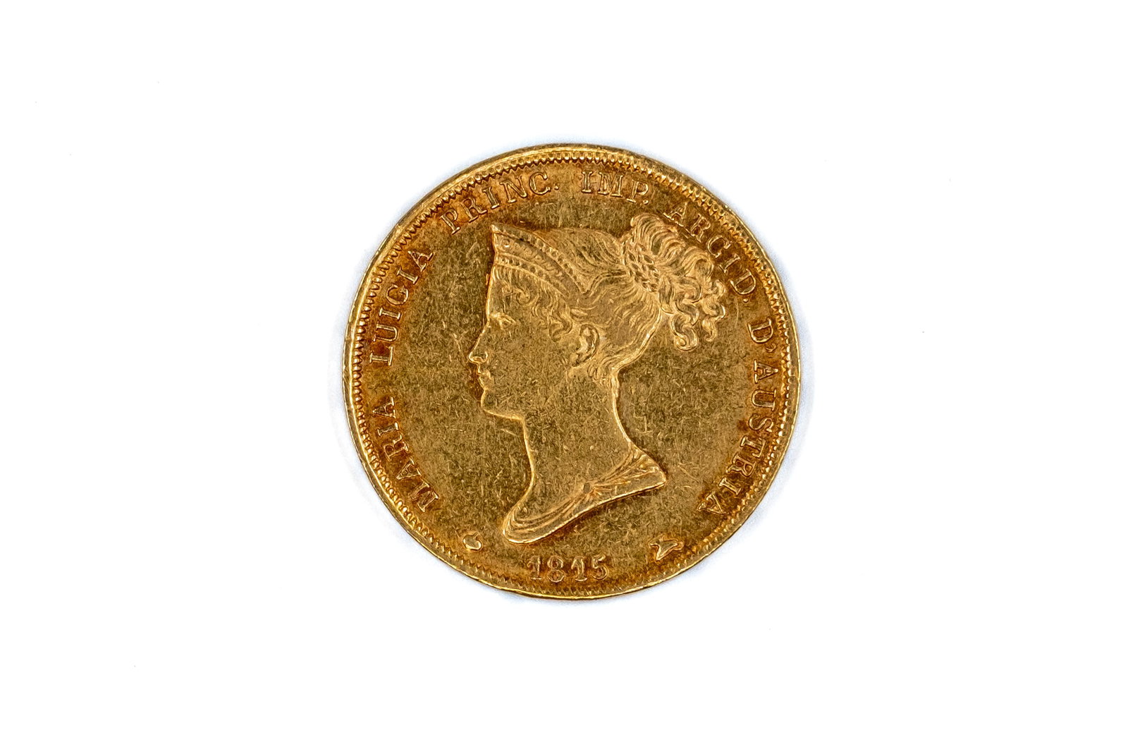 A Parma gold 40 Lire coin of Marie Louise, dated 1815: A Parma gold 40 Lire coin of Marie Louise, dated 1815. With bust of Marie Louise on the obverse, and crowned arms within mantle on the reverse. Weight: 12,9g