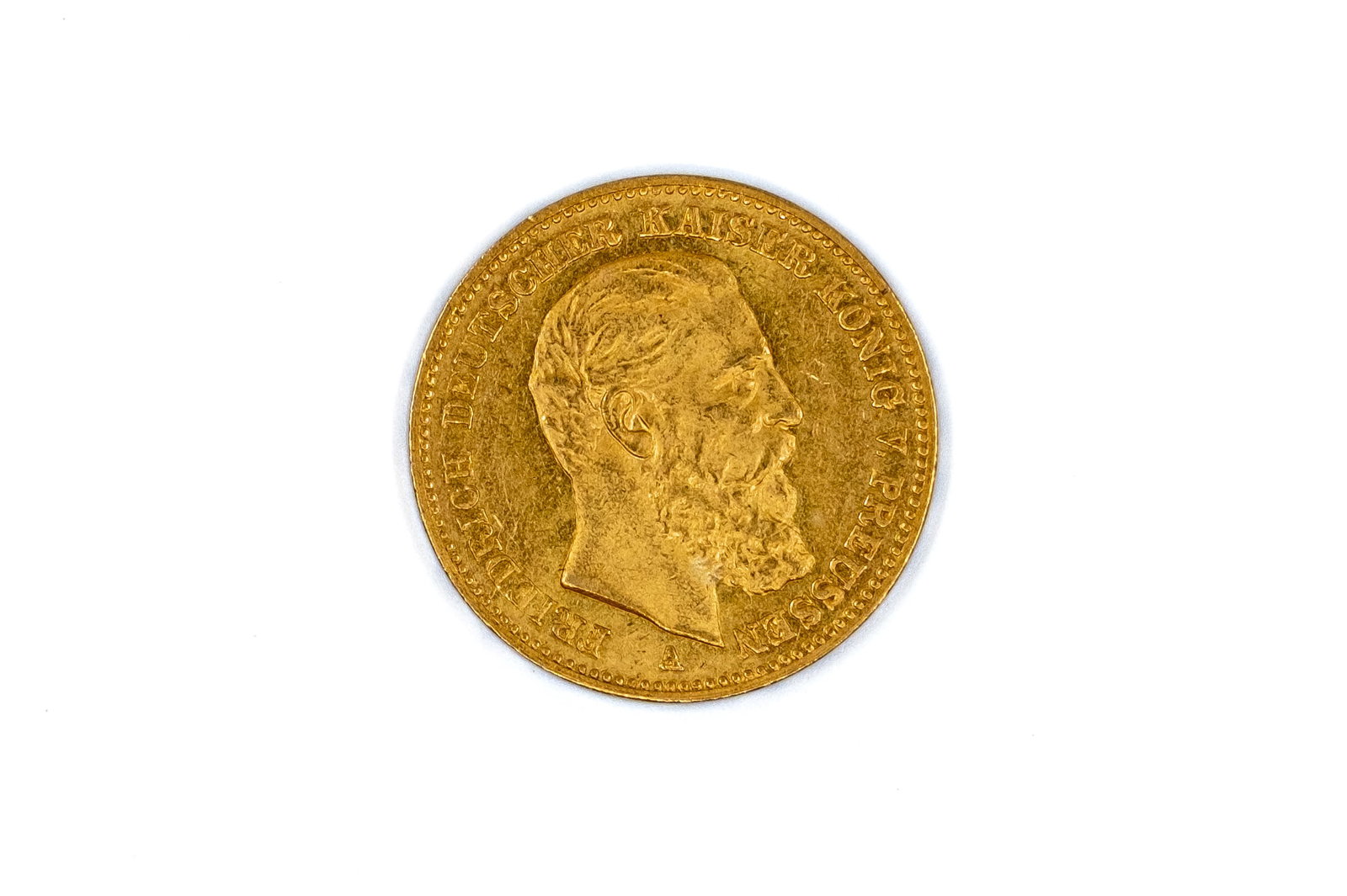 A German gold 20 Mark coin of Prussia, Friedrich III, dated 1888: A German gold 20 Mark coin of Prussia, Friedrich III, dated 1888. With bare head of Friedrich III right on the obverse, and crowned imperial eagle with shield on the reverse. Weight: 8g