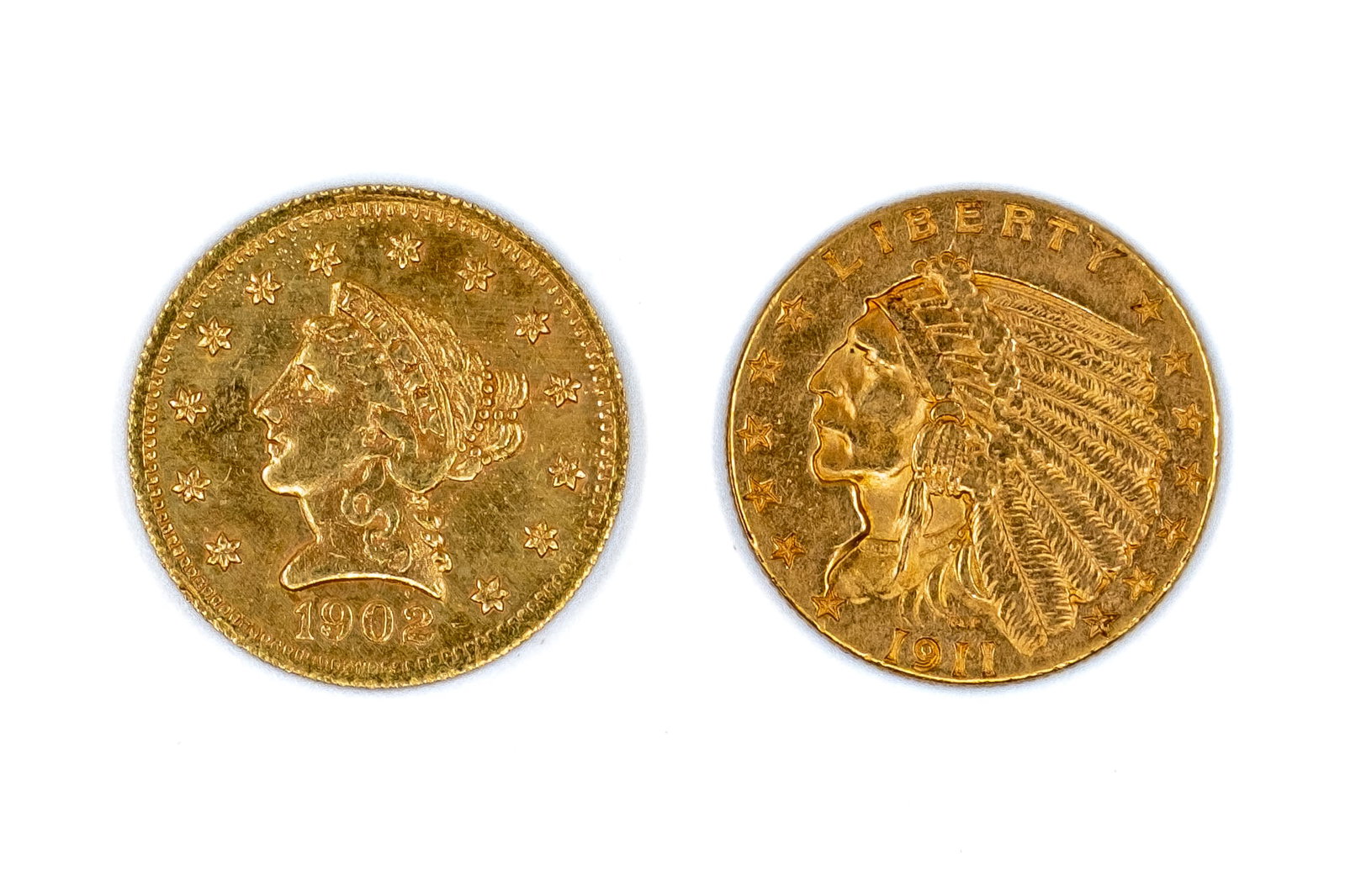 Two United States gold quarter eagles: Two United States gold quarter eagles, Liberty Head and Indian Head types, dated 1902 and 1911. With Liberty Head and Native American chief portraits on the obverses, and eagle motifs with denominatio
