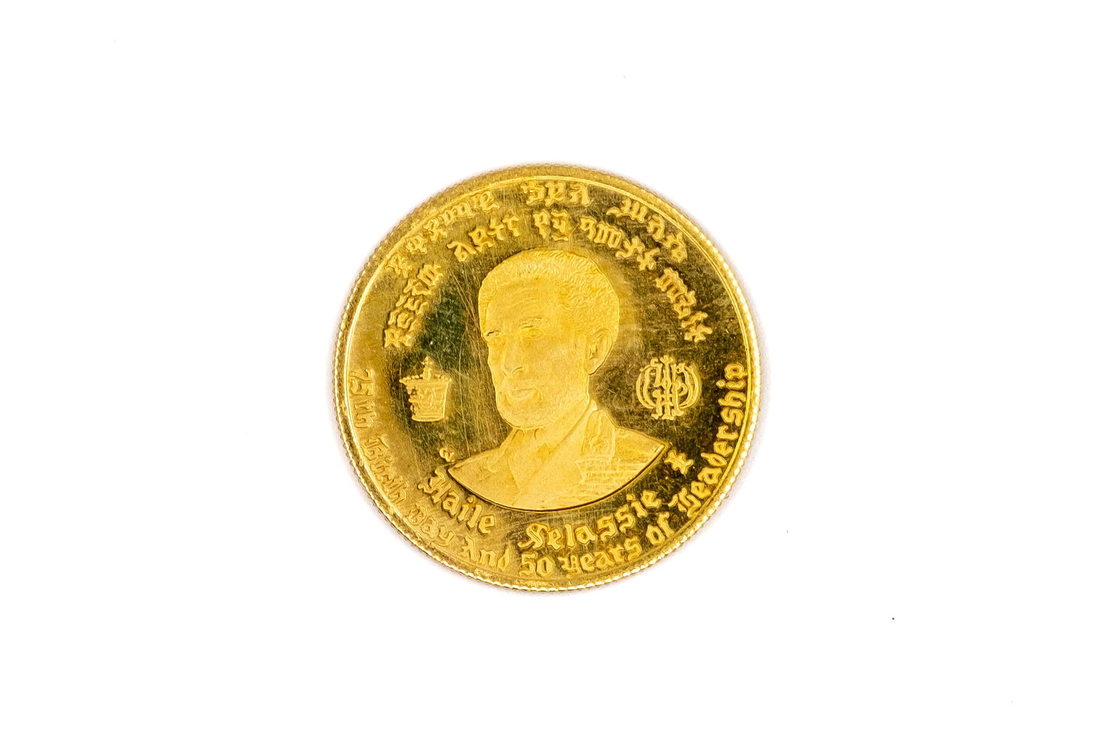An Ethiopian gold 10 dollars coin, dated 1966: An Ethiopian gold 10 dollars coin, dated 1966. Issued for the 75th birthday and 50 years of leadership of Haile Selassie I, with portrait obverse and Lion of Judah reverse, accompanied by its original