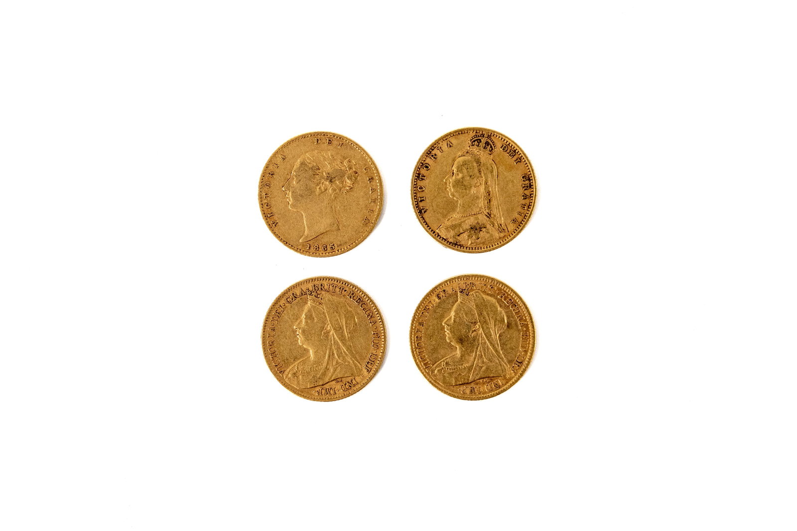 A lot of four British gold half sovereigns of Queen Victoria, dated 1865-1900: Lot 1032. A lot of four British gold half sovereigns of Queen Victoria, dated 1865-1900. Comprising young head, Jubilee head and veiled head issues, with crowned shield and St George slaying the drago