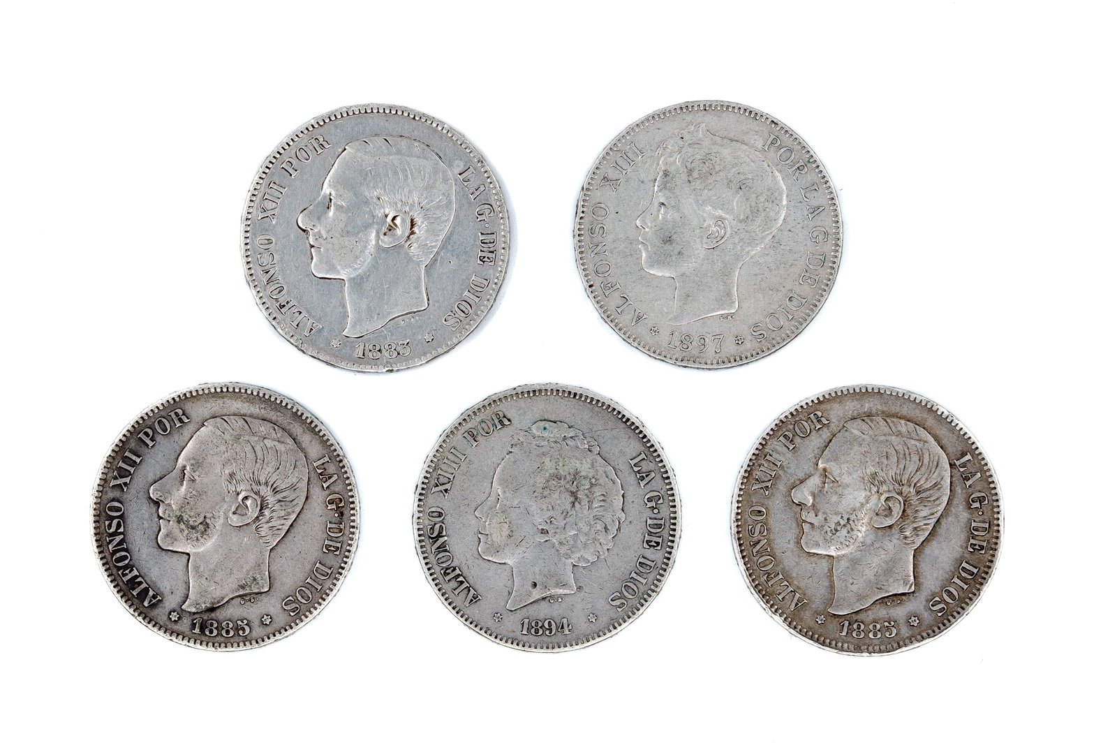 A lot of five Spanish silver 5 Pesetas coins of Alfonso XII and Alfonso XIII: A lot of five Spanish silver 5 Pesetas coins of Alfonso XII and Alfonso XIII, dated 1883, 1885, 1885, 1894, and 1897. Featuring royal portrait obverses and crowned coat of arms reverse. Total weight: 