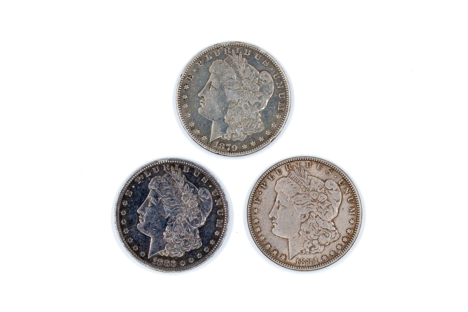 A lot of three United States silver Morgan Dollars (1 of 2)