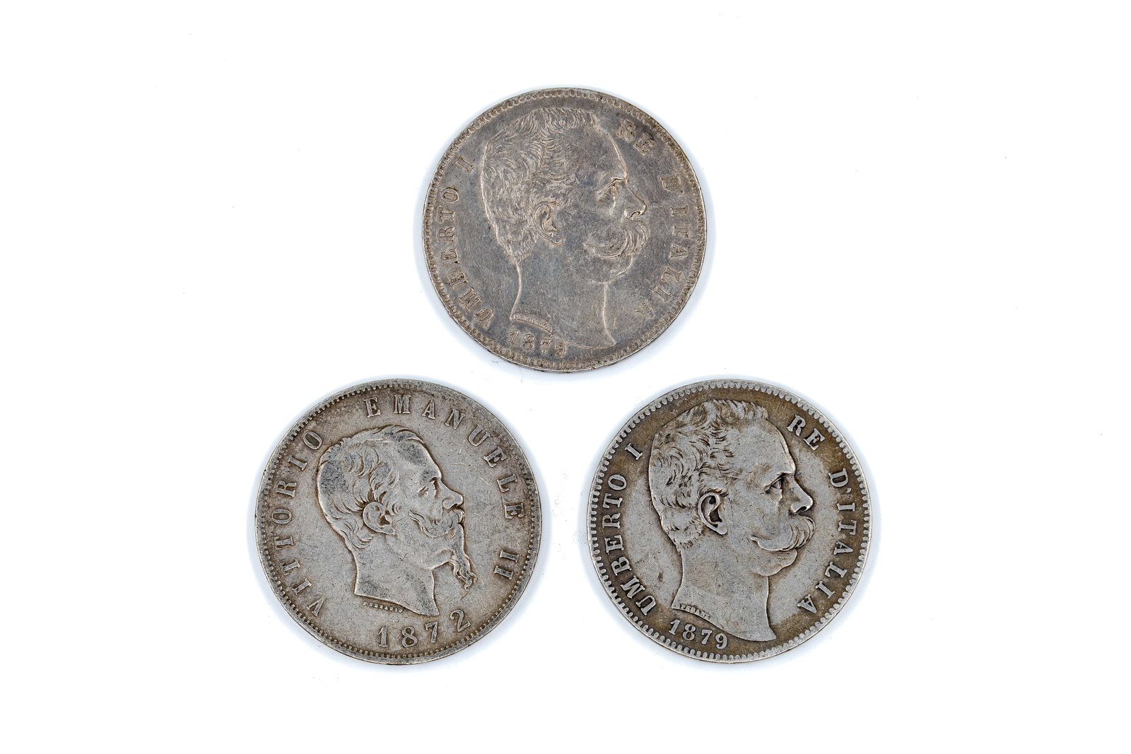 A lot of three Italian silver 5 Lire coins: A lot of three Italian silver 5 Lire coins, comprising one of Vittorio Emanuele II (dated 1872) and two of Umberto I (both dated 1879). With portraits of the kings on the obverse and crowned Savoy shi