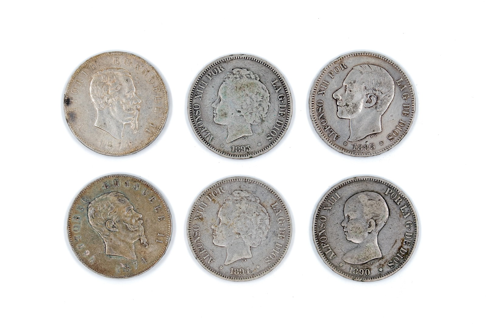 A lot of six silver coins comprising Italy and Spain, dated 1874-1894: A lot of six silver coins comprising Italy and Spain, dated 1874-1894. Including two Italian 5 Lire coins of Vittorio Emanuele II and four Spanish 5 Pesetas coins of Alfonso XII and Alfonso XIII. Obve