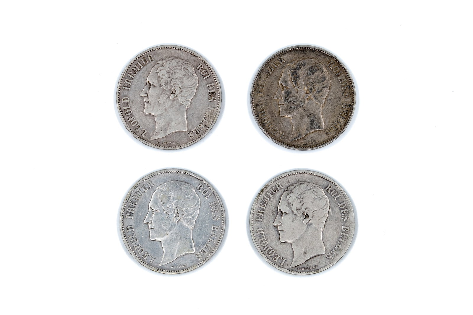 A lot of four Belgian silver 5 Francs coins of Leopold I, dated 1849-1853: A lot of four Belgian silver 5 Francs coins of Leopold I, dated 1849-1853. With portrait of the king on the obverse. Reverse with crowned Belgian coat of arms within wreath and denomination. Total wei