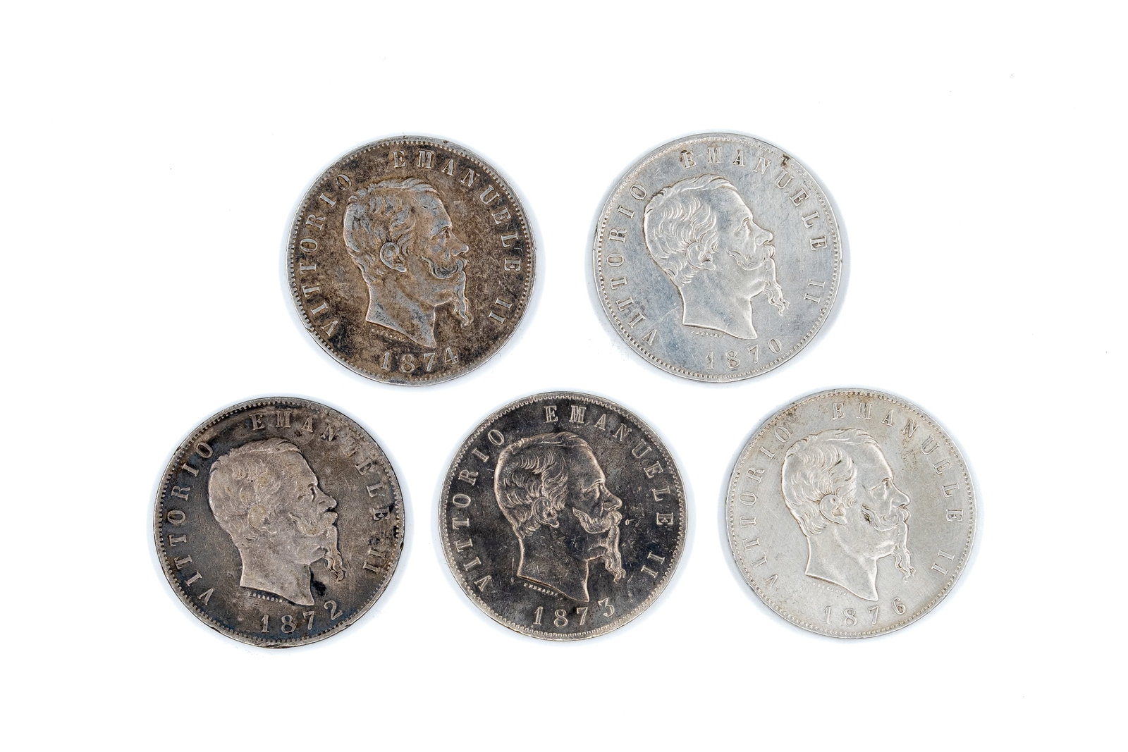 A lot of five Italian silver 5 Lire coins of Vittorio Emanuele II, dated 1870-1876: A lot of five Italian silver 5 Lire coins of Vittorio Emanuele II, dated 1870-1876. With portrait of the king on the obverse. Reverse with crowned Savoy shield within wreath and denomination. Total we