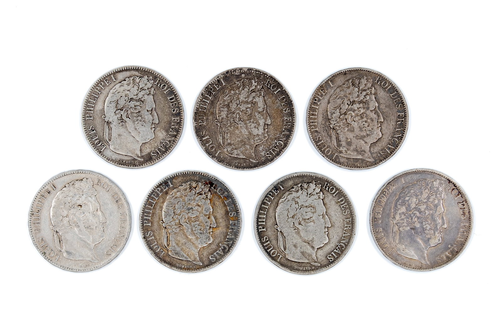 A lot of seven French silver 5 Francs coins of Louis Philippe I, dated 1834-1854: A lot of seven French silver 5 Francs coins of Louis Philippe I, dated 1834-1854. With laureate portrait of the king on the obverse. Reverse with denomination within wreath. Total weight: 173,4g