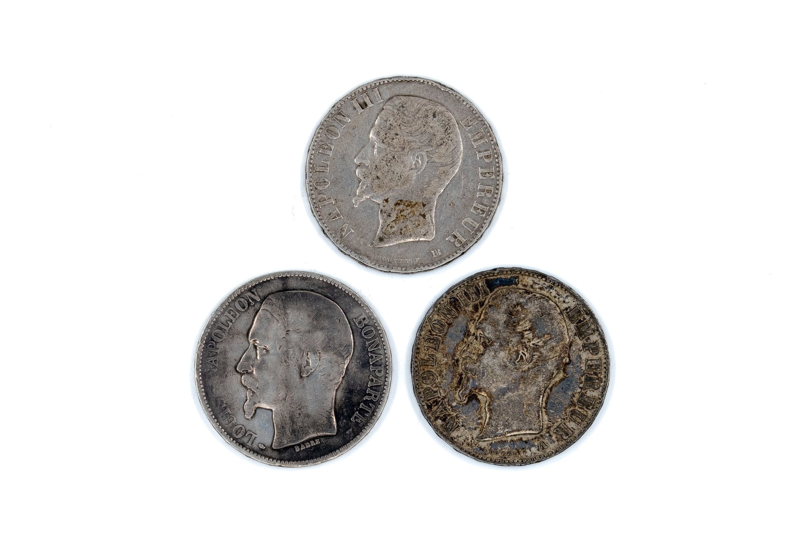 A lot of three French silver 5 Francs coins of Louis-Napoléon Bonaparte and Napoleon III: A lot of three French silver 5 Francs coins of Louis-Napoléon Bonaparte and Napoleon III, dated 1852-1856. Comprising one issue of Louis-Napoléon Bonaparte as President of the Republic, and two issu