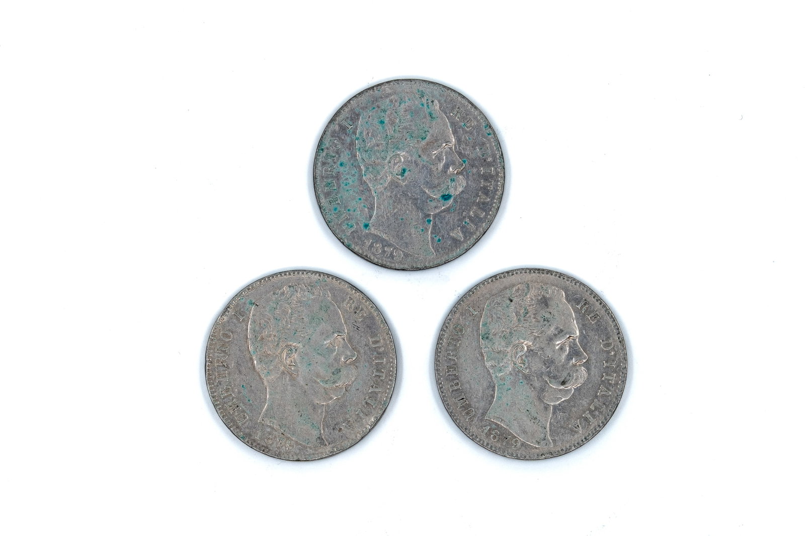 A lot of three Italian silver 5 Lire coins of Umberto I, all dated 1879: A lot of three Italian silver 5 Lire coins of Umberto I, all dated 1879. Comprising portrait issues of the king facing right, with royal titles on the obverse, and crowned shield within a wreath with 