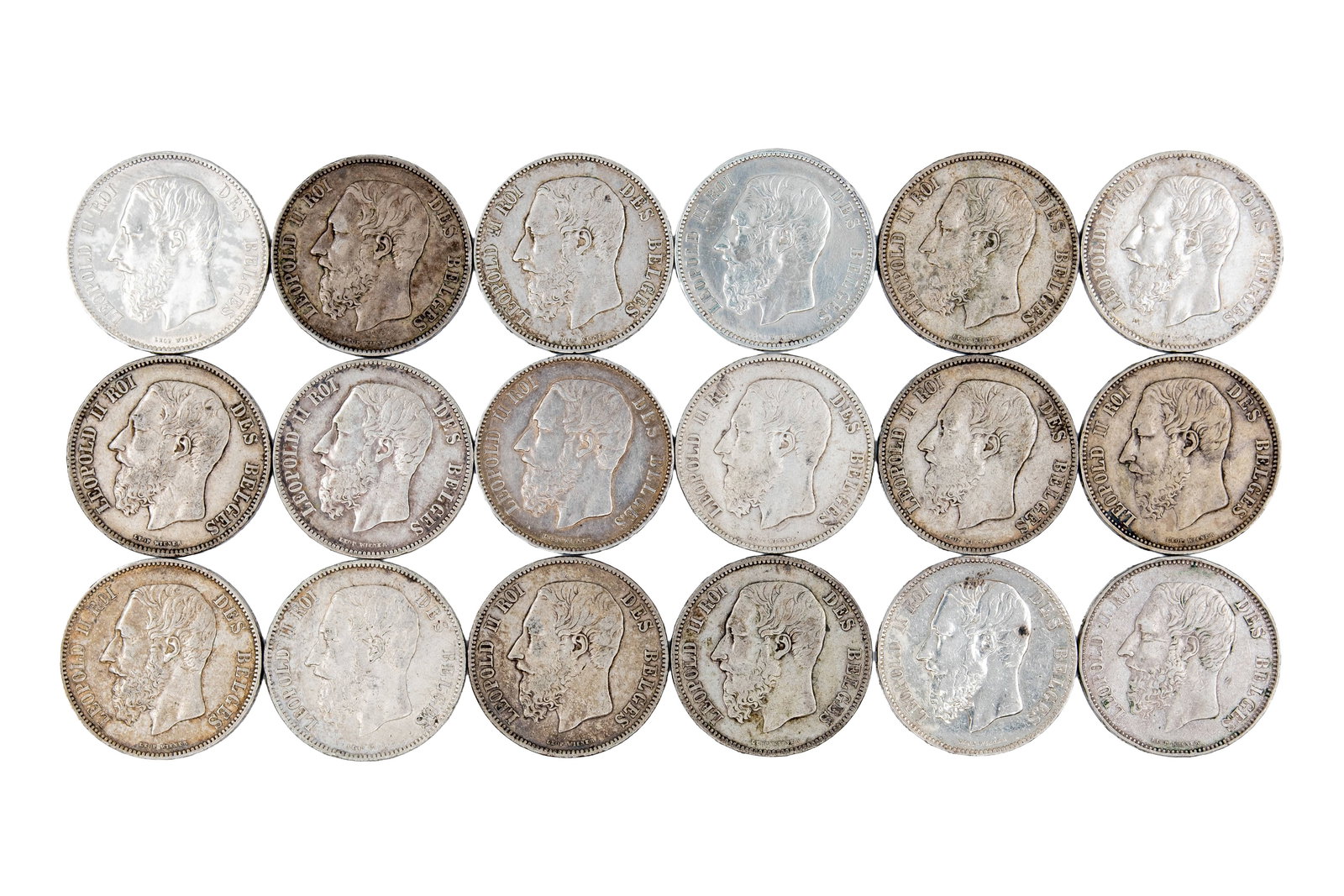 A large lot of 18 Belgian silver 5 Francs coins of Leopold II: A large lot of 18 Belgian silver 5 Francs coins of Leopold II, dated 1867-1876. Comprising portrait issues of the king facing left, with "Leopold II Roi des Belges" on the obverse, and crowned shield 