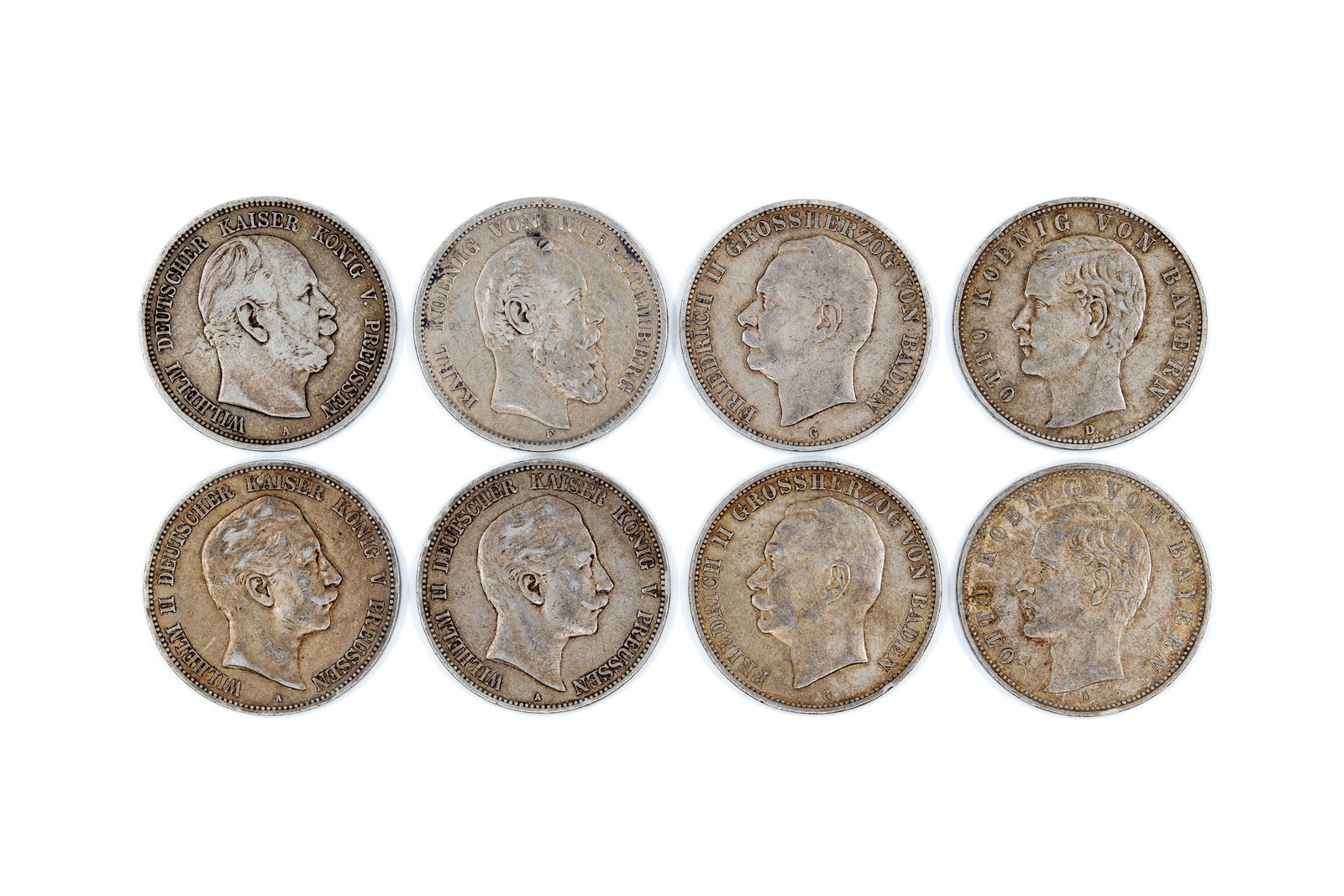 A lot of eight German silver 5 Mark coins of the German Empire, dated 1875-1908: A lot of eight German silver 5 Mark coins of the German Empire, dated 1875-1908. Comprising issues of various states including Prussia, Württemberg, Baden and Bavaria, with obverses depicting the res