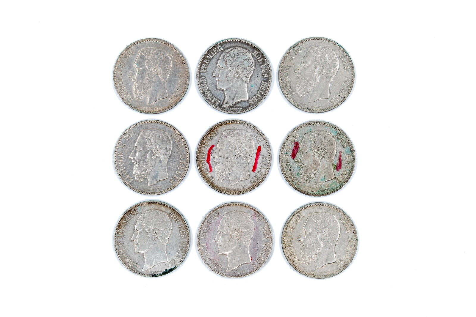 A lot of nine Belgian silver 5 Francs coins of Leopold I and Leopold II, dated 1865-1872: A lot of nine Belgian silver 5 Francs coins of Leopold I and Leopold II, dated 1865-1872. Comprising issues of both rulers, with obverses depicting the respective kings, and the reverse showing the cr
