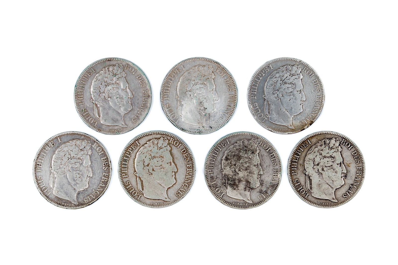 Lot of seven French silver 5 Francs coins (Louis-Philippe I), dated 1842-1844: Lot of seven French silver 5 Francs coins (Louis-Philippe I), dated 1842-1844. Comprising 5 Francs coins dated 1842, 1843, and 1844, with laurel wreath reverses and denomination within wreath. Total w