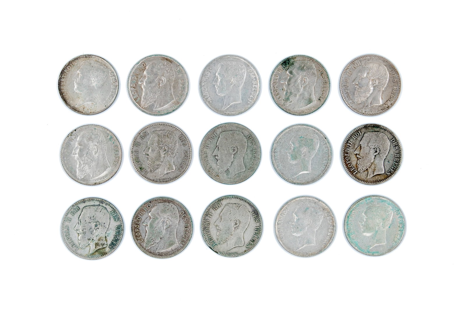 Lot of 15 Belgian silver 1 Franc coins (Leopold II and Albert I), dated 1867-1913: Lot of 15 Belgian silver 1 Franc coins (Leopold II and Albert I), dated 1867-1913. Comprising 1 Franc coins dated 1867-1913, with crowned coat of arms or denomination within wreath on reverse. Total w