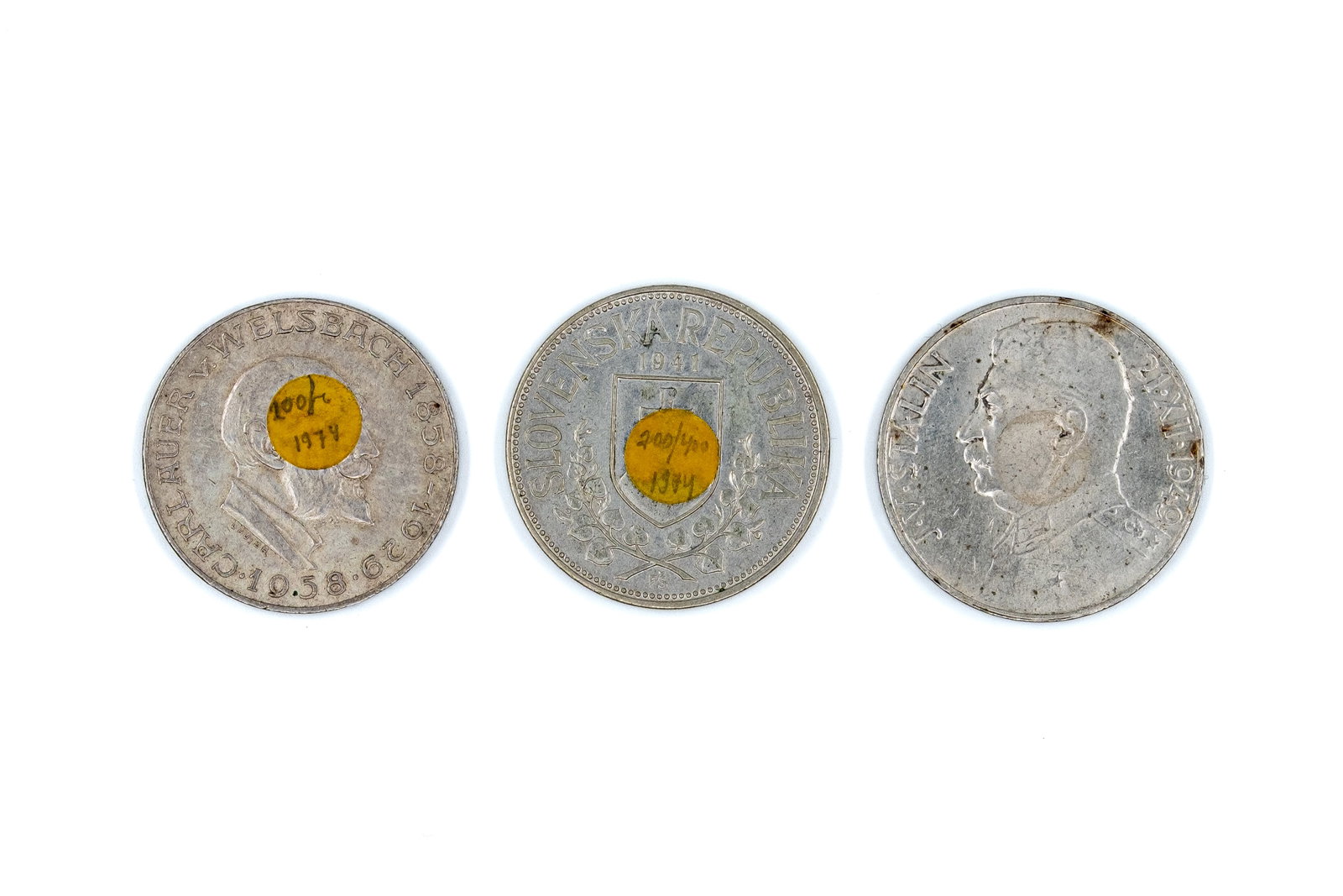 A lot of three European silver coins, dated 1941-1958: A lot of three European silver coins, dated 1941-1958. Comprising Austria 25 Schilling 1958, Slovakia 20 Korun 1941, and a Czechoslovak 100 Korun coin with portrait of Stalin dated 1949, with national
