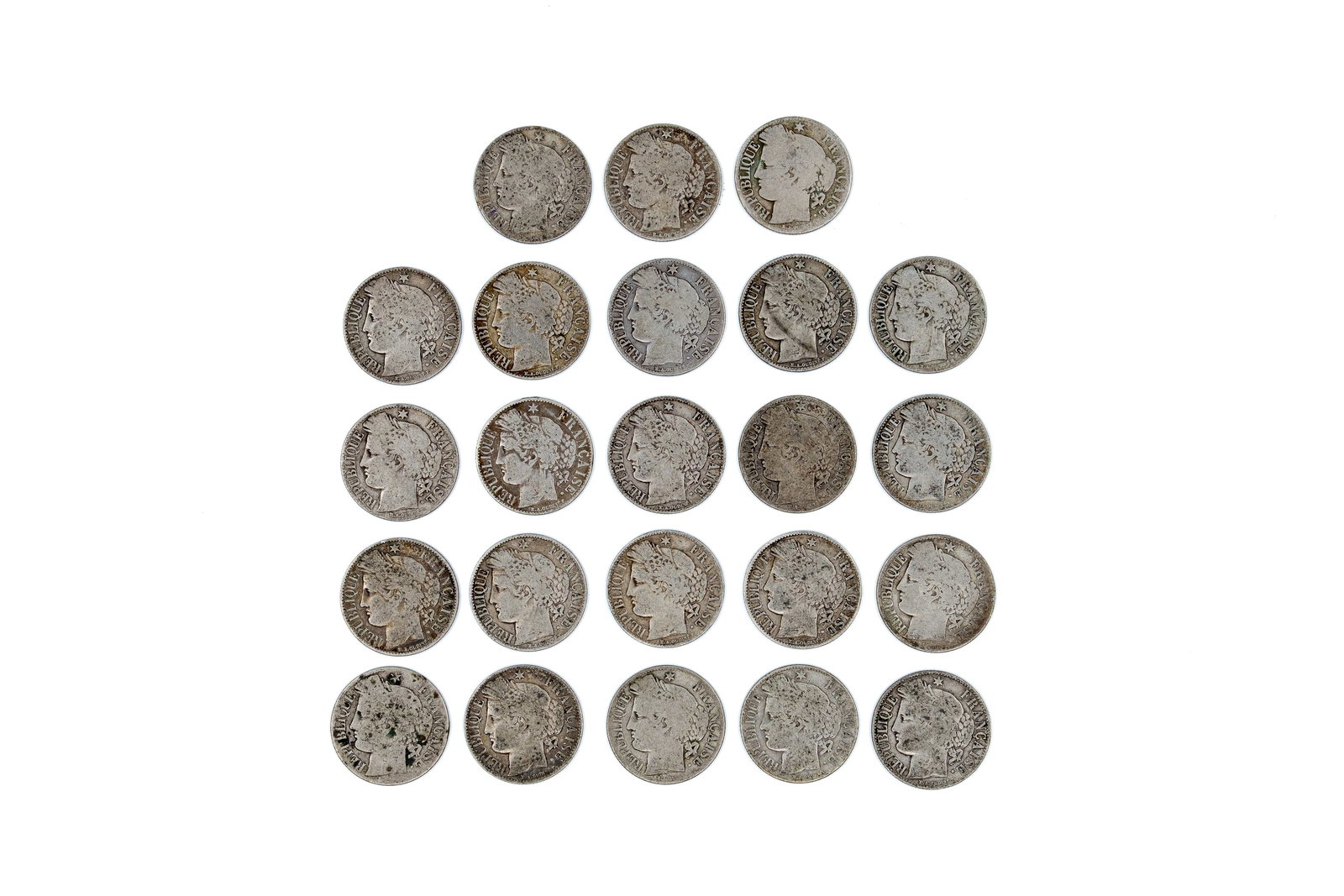 A lot of 23 French silver 1 Franc coins, dated circa 1870s-1890s: A lot of 23 French silver 1 Franc coins, dated circa 1870s-1890s. Comprising multiple 1 Franc pieces of the Third Republic type ("République Française"), with denomination within wreath on reverse a
