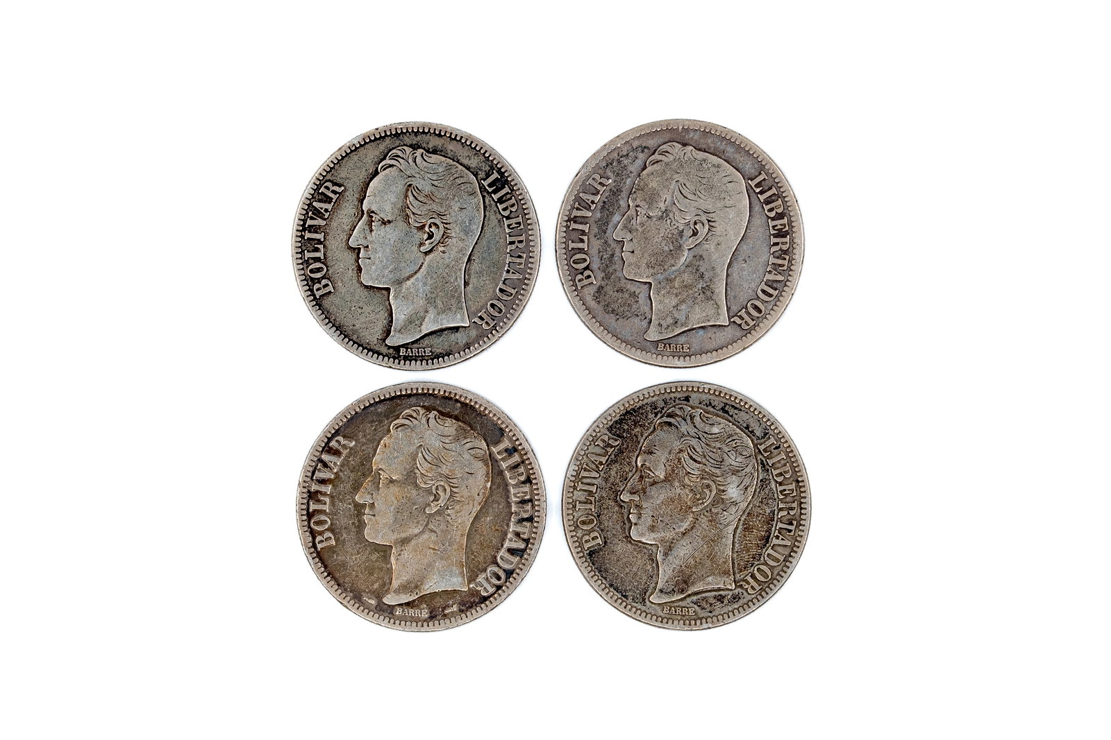 A lot of four Venezuelan silver 5 Bolívares coins, dated 1911-1936: A lot of four Venezuelan silver 5 Bolívares coins, dated 1911, 1926, 1935 and 1936. Comprising issues with the national coat of arms on the reverse and portrait of Simón Bolívar on the obverse. Wei