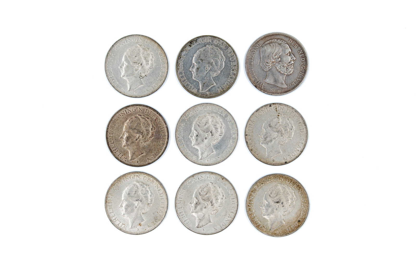 A lot of nine Dutch silver 2½ Gulden coins, dated 1871-1938 (1 of 2)