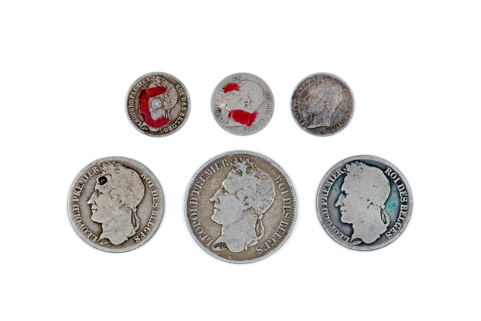 A lot of six Belgian silver coins, various issues of Leopold I, dated 1834-1853: A lot of six Belgian silver coins, comprising 20 Centimes, ¼ Franc, 1 Franc and 2 Francs issues of Leopold I, dated 1834-1853. Including various denominations with wreath reverses and crowned s