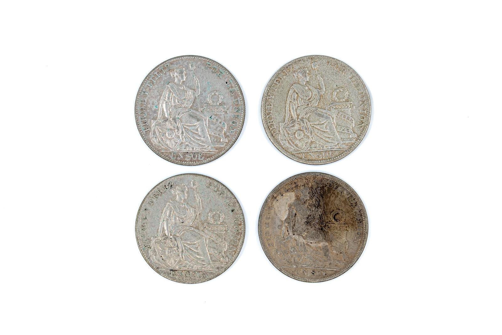 A lot of four Peruvian silver coins, all Un Sol issues, dated 1824-1935 (1 of 2)