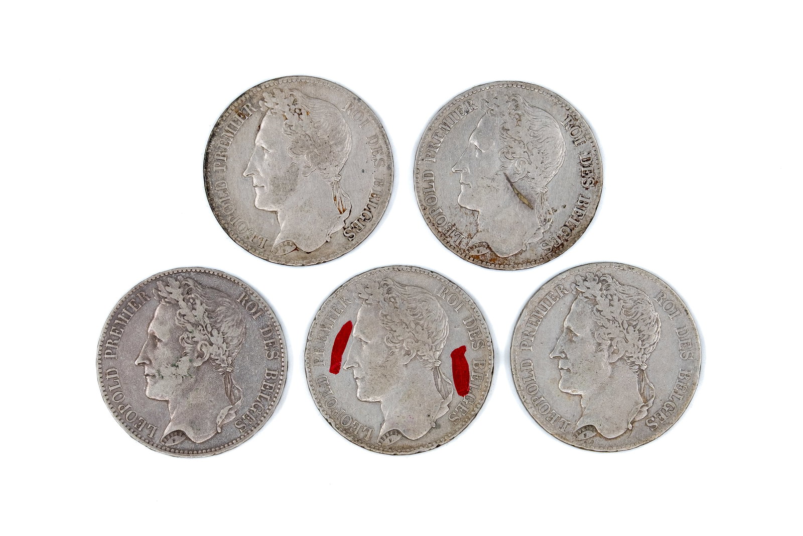 A lot of five French silver 5 francs coins of Leopold I, dated 1833-1848: A lot of five French silver 5 francs coins of Leopold I, dated 1833-1848. All issues with laureate head of Leopold I on the obverse and wreath with denomination reverse. Total weight: 124g