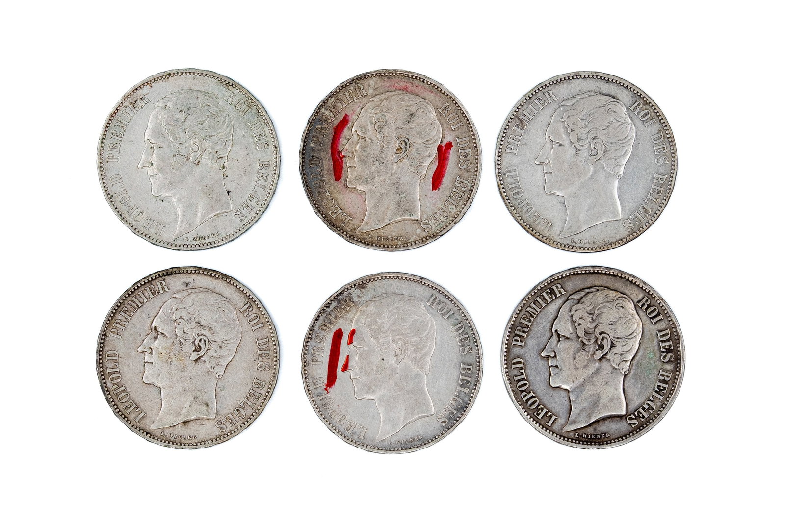 A lot of six Belgian silver 5 francs coins of Leopold I, dated 1849-1865: A lot of six Belgian silver 5 francs coins of Leopold I, dated 1849-1865. All issues with portrait of Leopold I on the obverse and crowned coat of arms within wreath reverse. Total weight: 149,7g