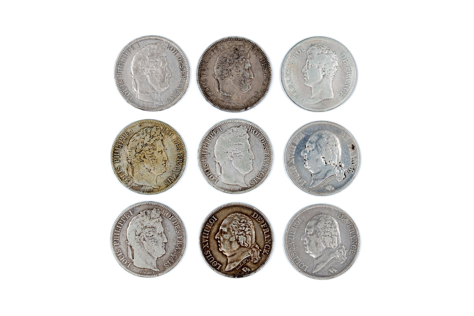 A lot of nine French silver 5 Francs coins of various kings, dated 1822-1840: A lot of nine French silver 5 Francs coins, Louis XVIII, Charles X and Louis Philippe I, dated 1822-1840. Featuring portraits of the respective rulers on the obverse, and crowned shield or wreath desi