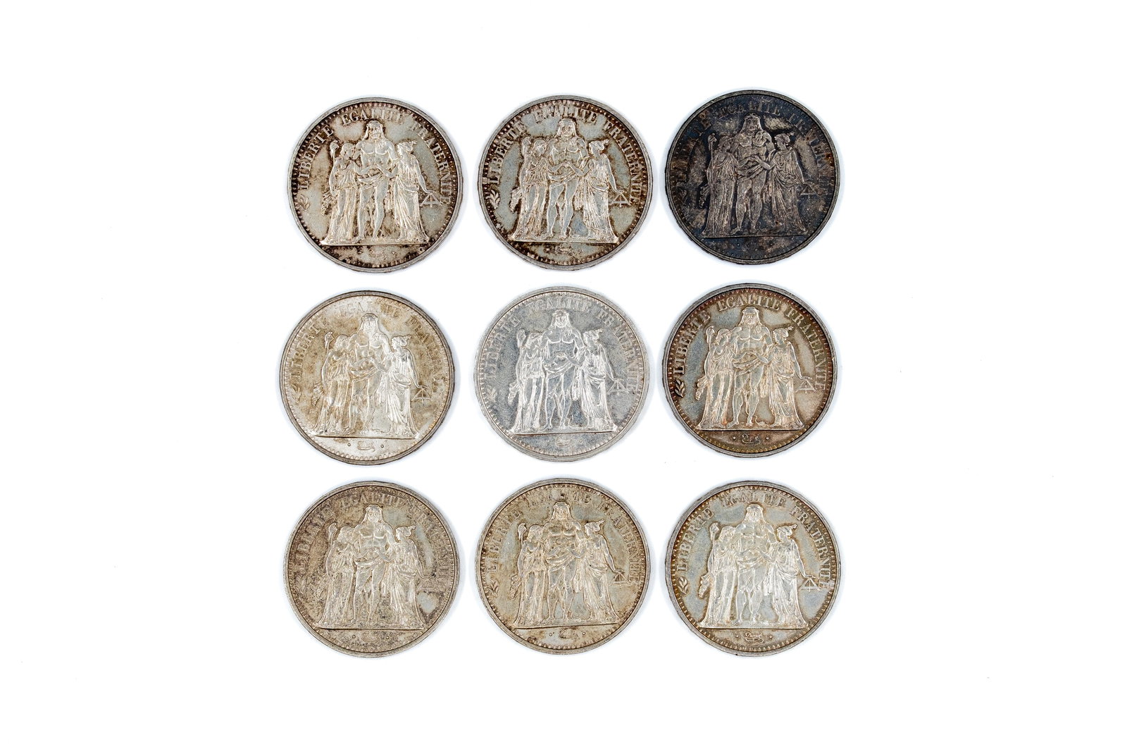 A lot of nine French silver 10 Francs coins, dated 1965-1968: A lot of nine French silver 10 Francs coins, dated 1965-1968. All issues with the Hercules group on the obverse and wreath with denomination on the reverse. Total weight: 225,6g